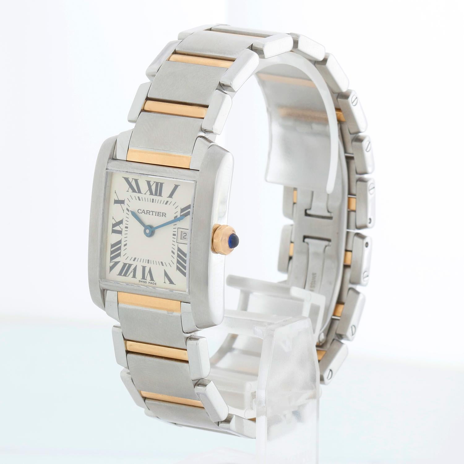 Cartier Tank Francaise Midsize Stainless Steel & Yellow Gold Watch 2465 W51012Q4 - Quartz. Stainless steel & yellow gold case (25mm x 30mm). Ivory colored dial with black Roman numerals; date at 3 o'clock. Stainless steel and yellow gold Cartier