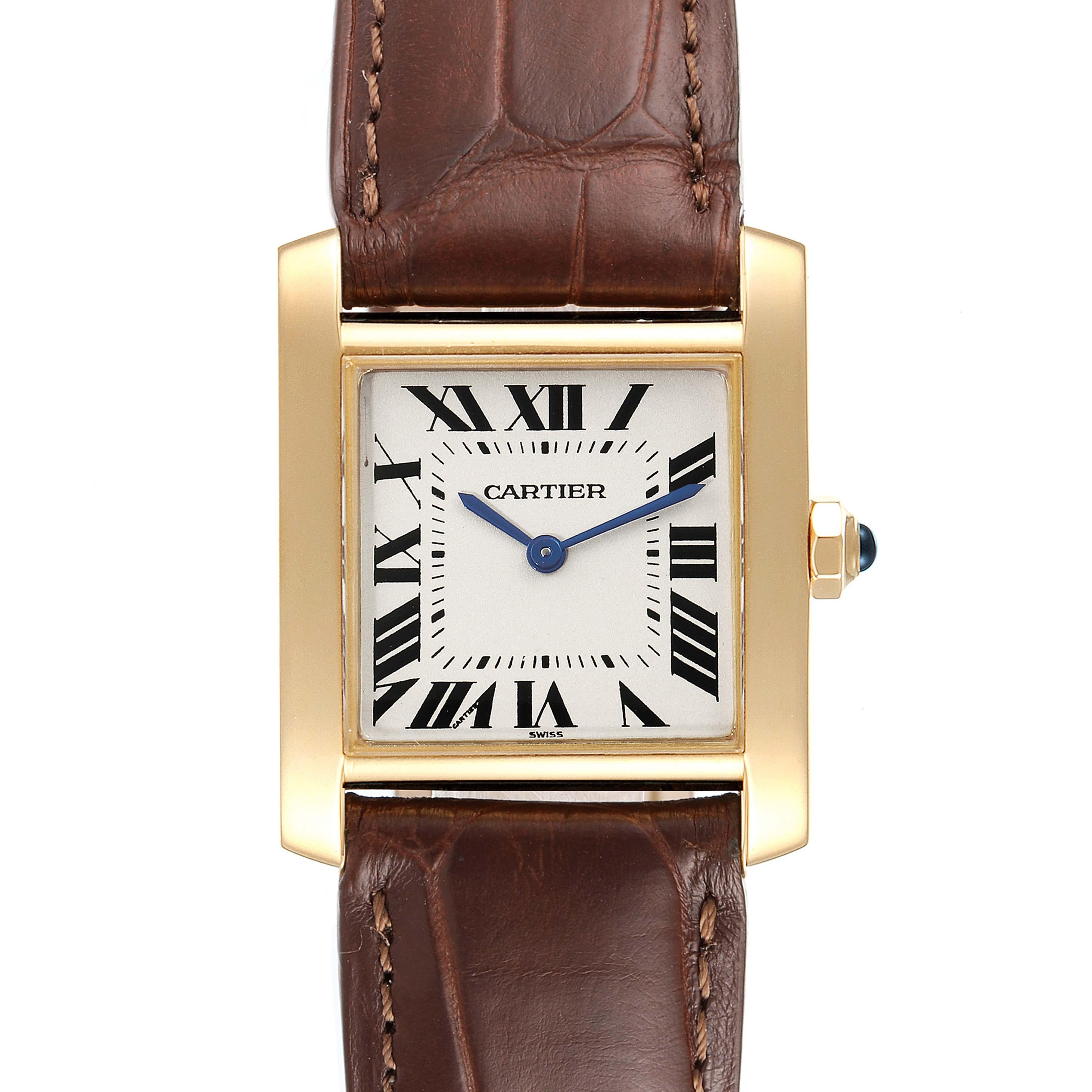 artier Tank Francaise Midsize Yellow Gold Ladies Watch W5000356. Quartz movement. 18K yellow gold 25 x 30 mm rectangular case. Octagonal crown set with a blue sapphire cabochon. . Scratch resistant sapphire crystal. Silver grained dial with painted