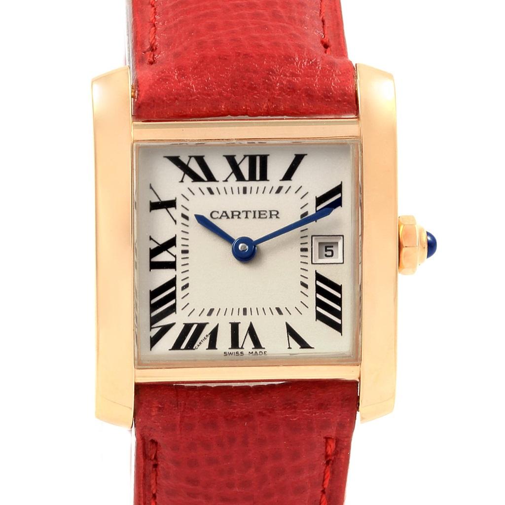 Cartier Tank Francaise Midsize Yellow Gold Red Strap Watch W50014N2. Quartz movement. Rectangular brushed and polished 18K yellow gold 25 x 30 mm case. Octagonal crown set with a blue sapphire cabochon. Scratch resistant sapphire crystal. Silver