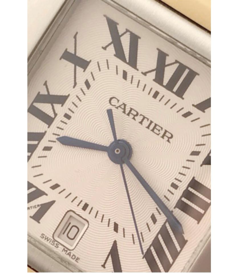 Charming and timeless. This beautiful Cartier Tank Française is in gorgeous condition. This watch features both 18k gold and stainless steel construction. The dial is a silver textured dial that features black Roman numerals. 6 o'clock date aperture