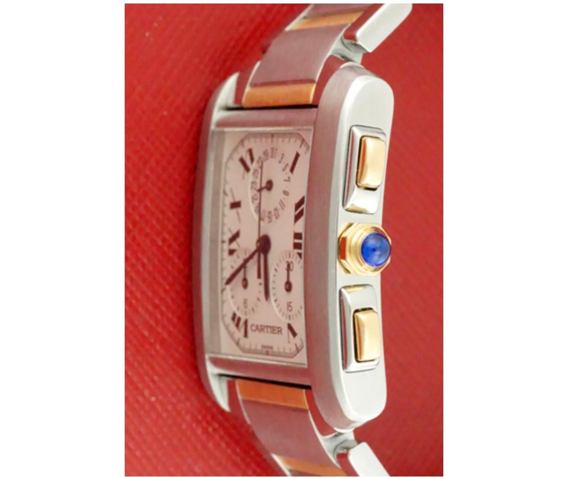 Charming and timeless. This beautiful Cartier Tank Française is in gorgeous condition. This watch features both 18k gold and stainless steel construction. The dial is a silver textured dial that features black Roman numerals. The crown is 18k gold