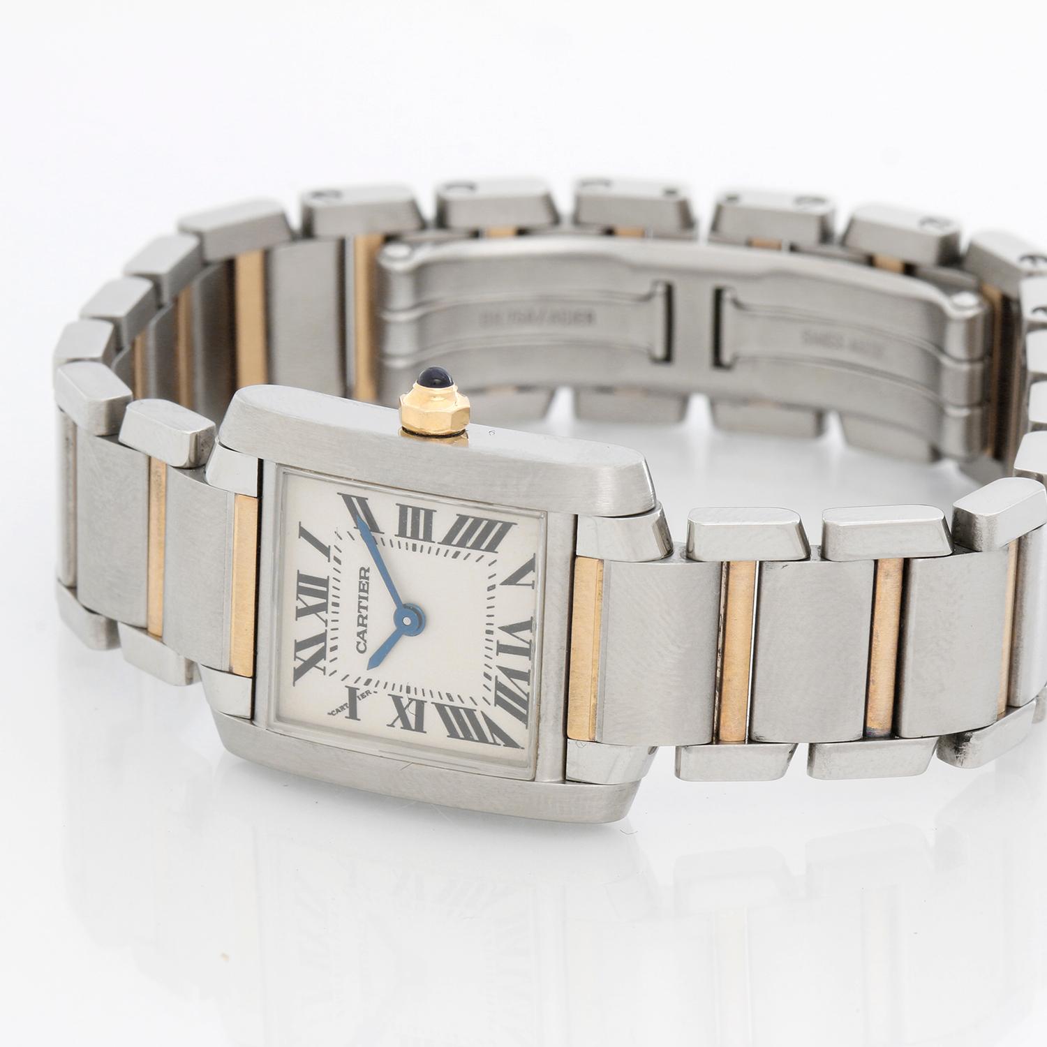 Cartier Tank Francaise Stainless  Steel and Yellow Gold  Ladies Watch W51008Q3 - Quartz. Stainless Steel (20 x 25mm ). Ivory colored dial with black Roman numerals. 2-Tone Cartier Tank Francaise bracelet with deployant clasp.. Pre-owned with Cartier