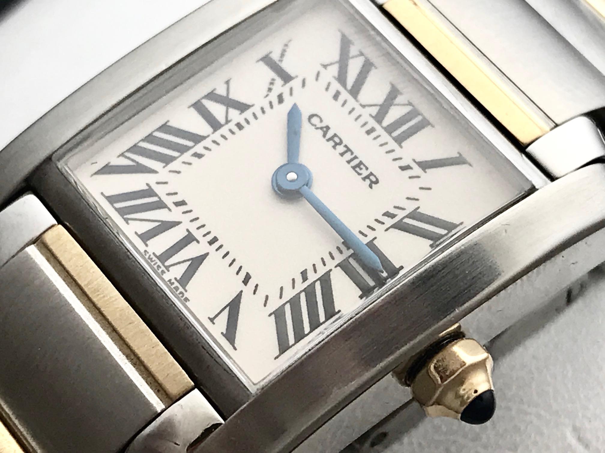 This beautiful Cartier Tank Francaise features a stainless steel square style case, and a two-tone bracelet made of stainless steel and 18k yellow gold. The white dial has black Roman numerals and wonderfully blued hour and minute hands. This watch