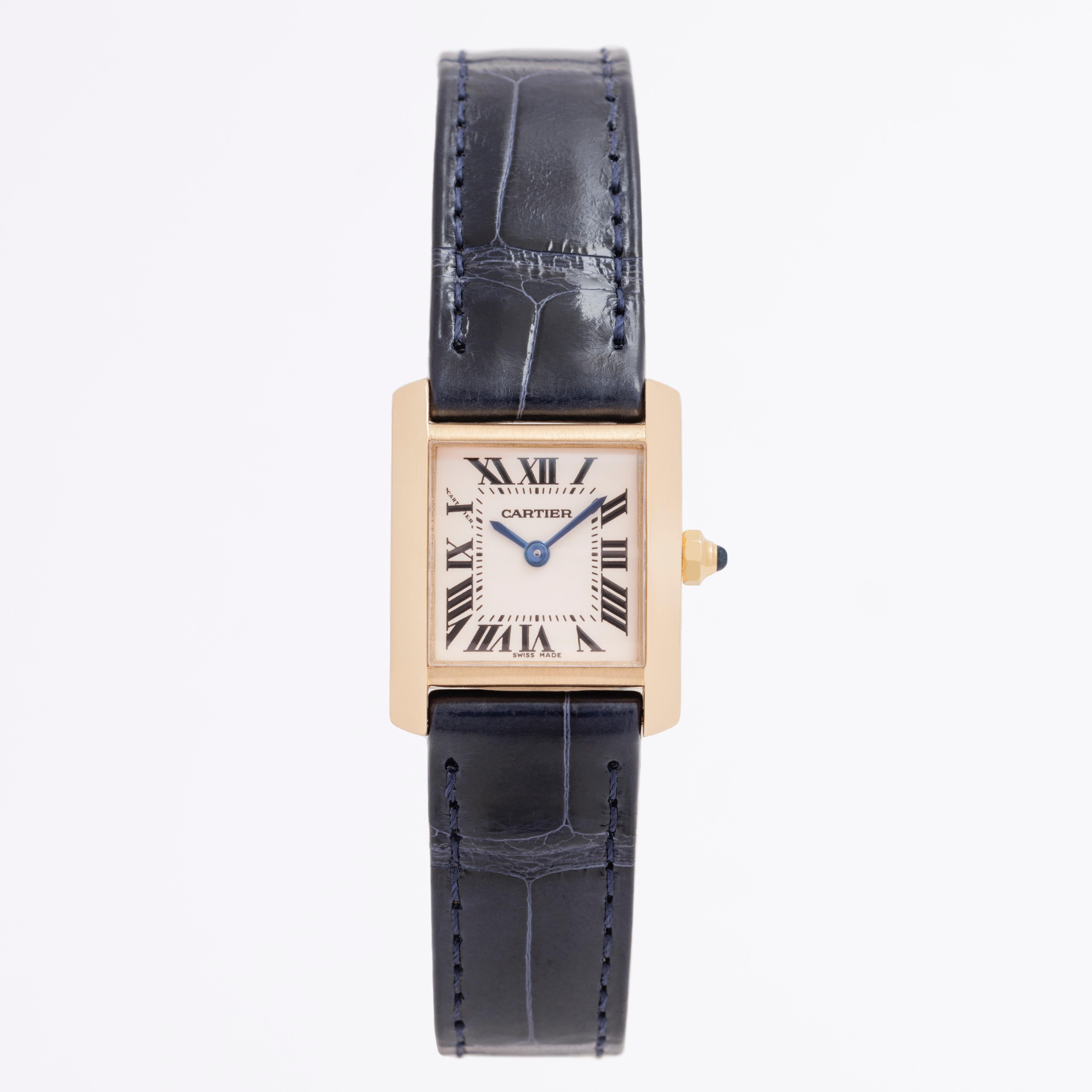 Cartier 18k Yellow Gold Tank Française Model W5000256  c.2000 
20mm x 25mm 
Cartier Navy Alligator Strap 
Quartz Movement
Like new condition. 
Ships in Cartier red velvet travel pouch



Stephanie Windsor guarantees the proper functioning of this