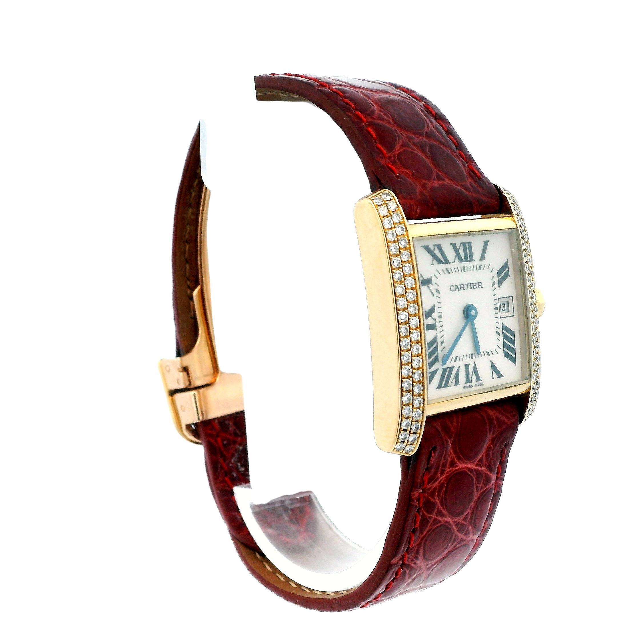Cartier Tank Francaise Midsize Ladies Watch. 25mm 18K yellow gold case with the original factory diamond bezel. Silver dial with blue steel hands and black Roman numeral hour markers. Minute markers on the inner dial. Burgundy leather strap with 18K