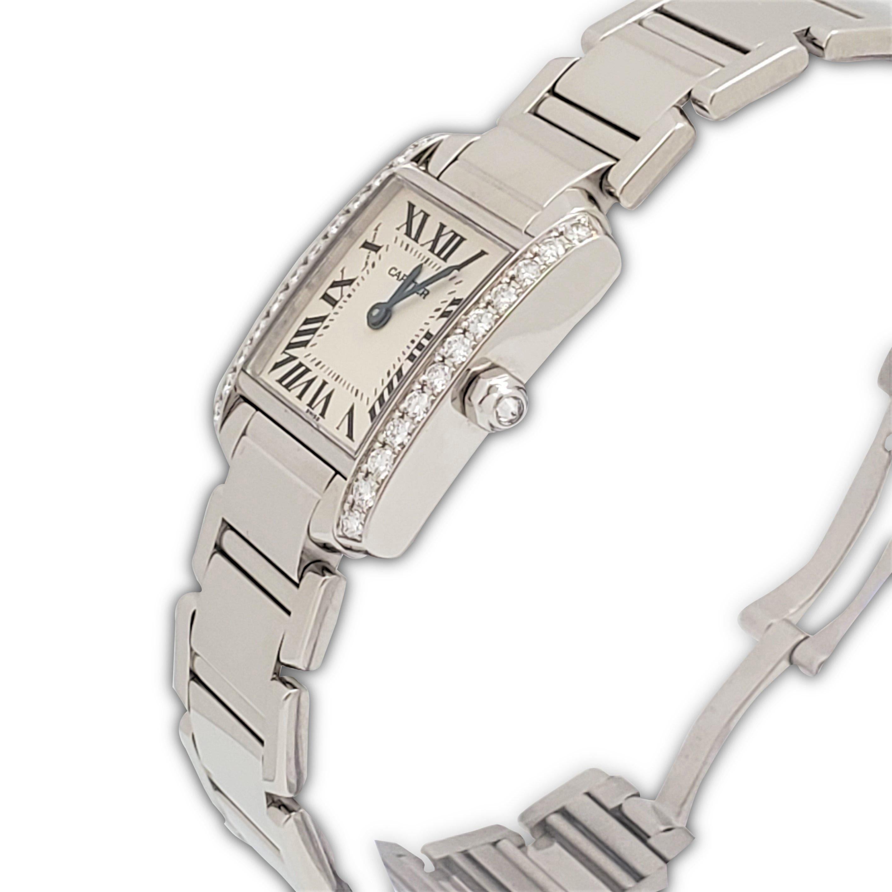 Authentic Cartier 'Tank Française' watch crafted in 18 karat white gold. The rectangular case (20 mm x 25 mm) is set with high-quality round brilliant cut diamonds and the octagonal crown is set with one diamond. Silvered dial with painted black