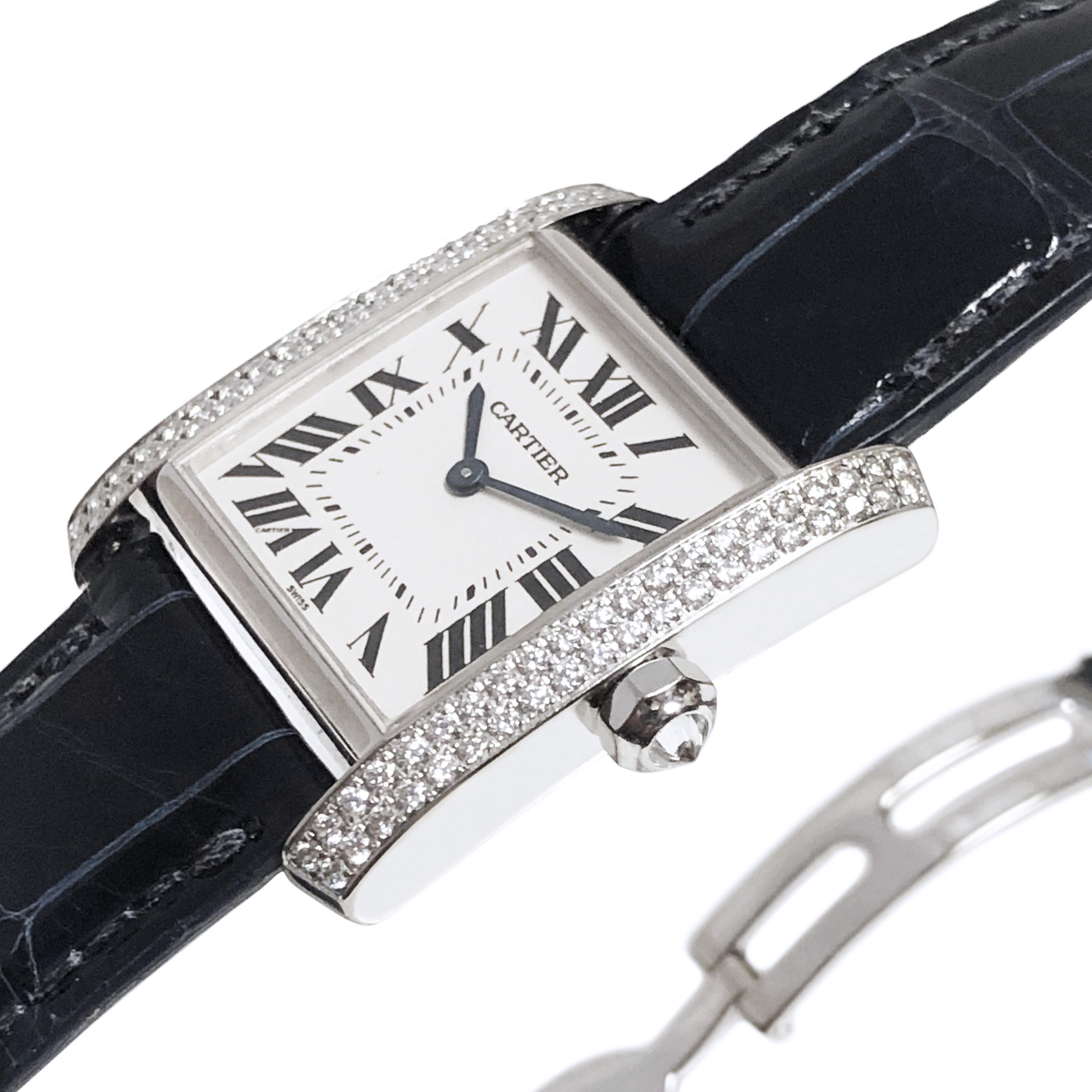 Circa 2017 Cartier Tank Francaise Wrist watch, 30 X 25 M.M. 18K White Gold 2 piece case set with 2 rows of Diamonds and a Diamond set Crown. Quartz Movement, White dial with Black Roman numerals. New Dark Blue Croco Strap with Gold Deployment