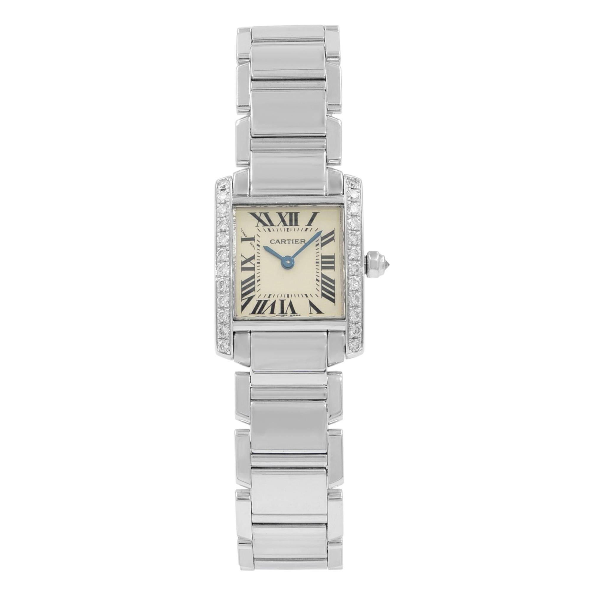 This pre-owned Cartier Tank  WE1002S3  is a beautiful Ladies timepiece that is powered by a quartz movement which is cased in an 18K white gold case. It has a round shape face,  dial, and has hand roman numerals style markers. It is completed with a