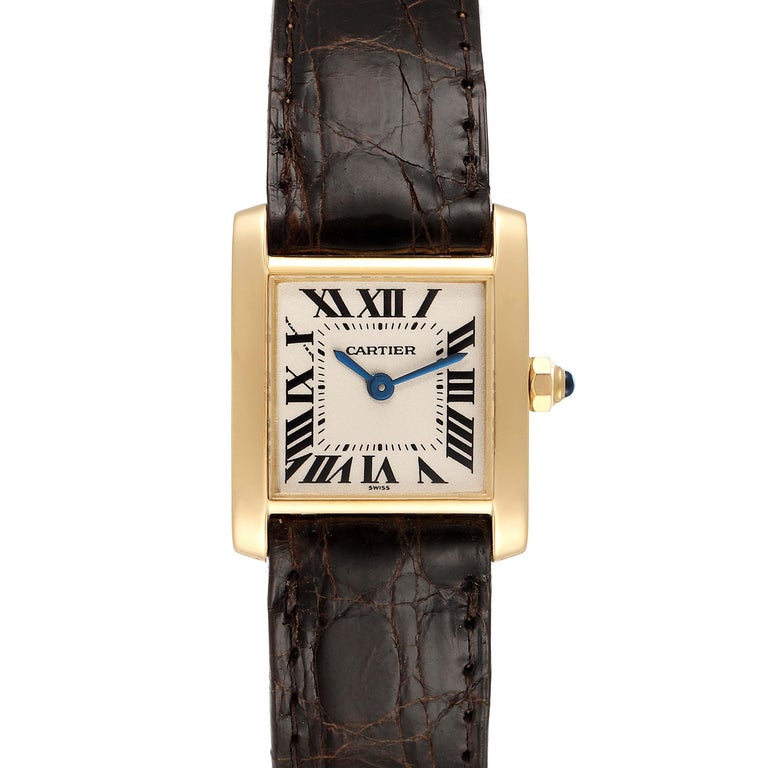 Cartier Tank Francaise Yellow Gold Brown Strap Ladies Watch W5000256. Quartz movement. 18K yellow gold rectangular case 20.0 x 25.0 mm case. Octagonal crown set with a blue sapphire cabochon. . Scratch resistant sapphire crystal. Silver dial with