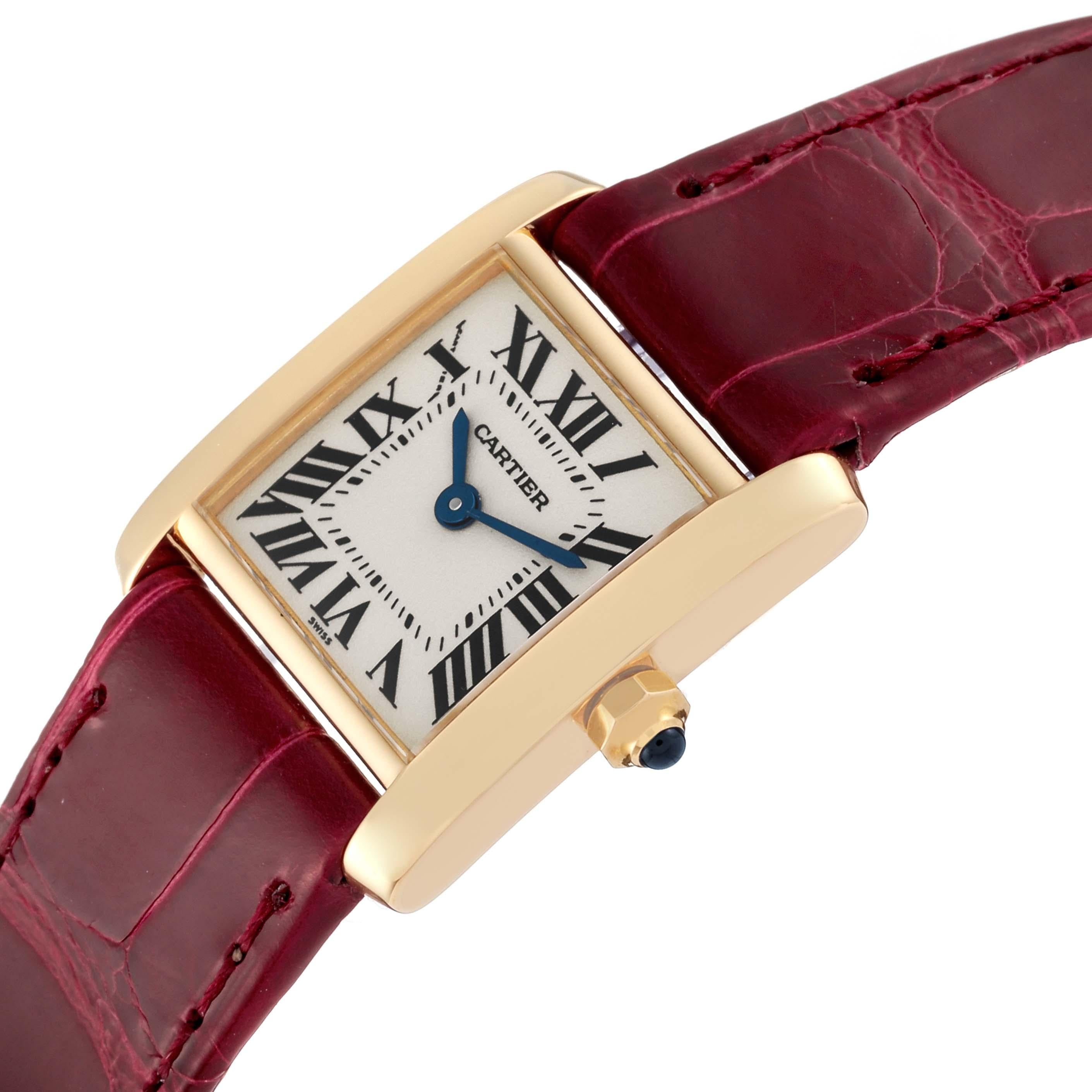 Cartier Tank Francaise Yellow Gold Burgundy Strap Ladies Watch W5000256. Quartz movement. 18K yellow gold rectangular case 20.0 x 25.0 mm case. Octagonal crown set with a blue sapphire cabochon. . Scratch resistant sapphire crystal. Silver dial with