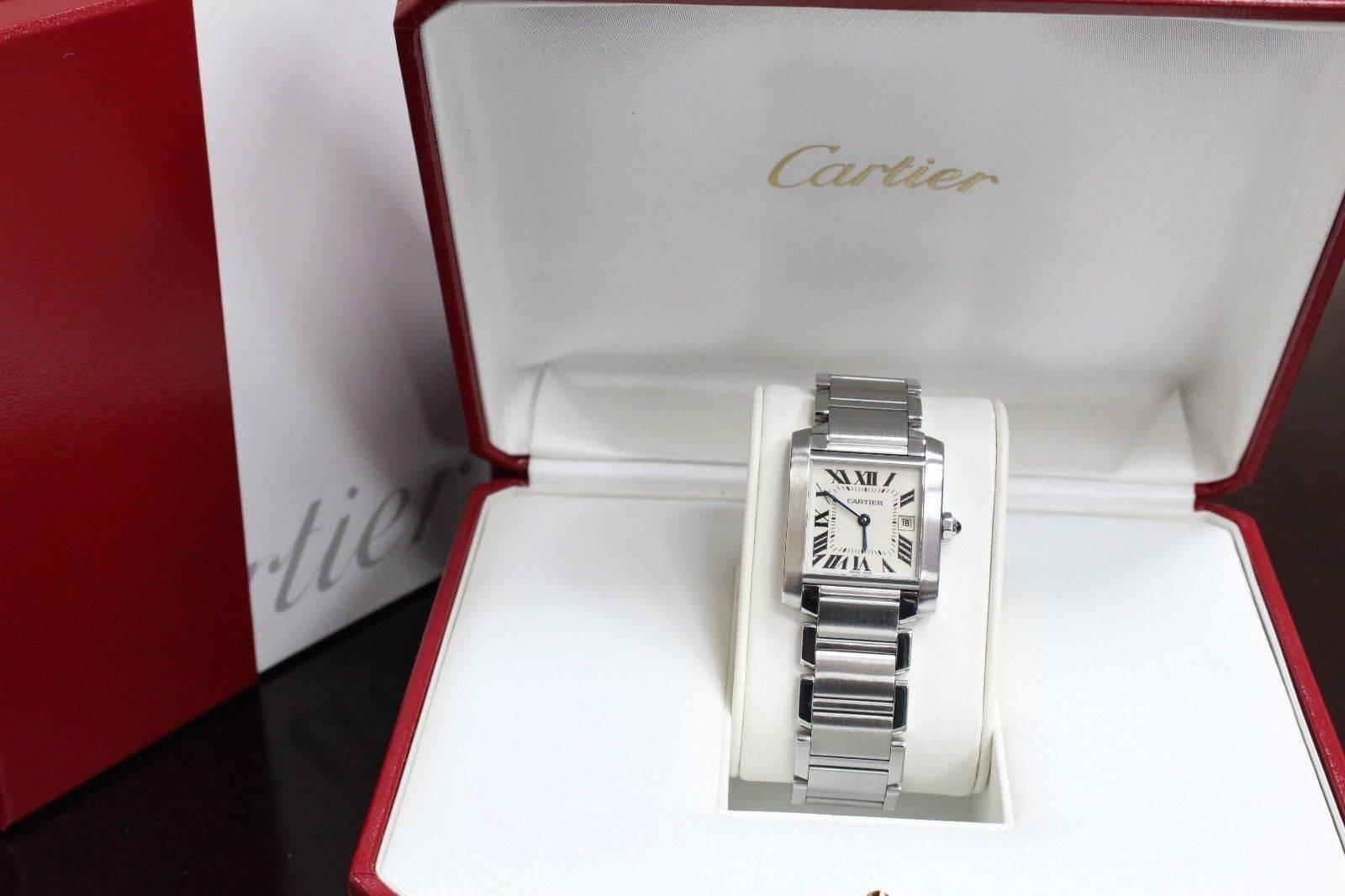 Style Number: 2465
Year: 2003
Model: Tank Francaise
Case: Stainless Steel
Band: Stainless Steel
Bezel: Stainless Steel
Dial: Silver
Face: Sapphire Crystal
Case Size: 25mm (Midsize)
Includes: 
-Cartier Box & Papers
-Certified Appraisal 
-6 Month