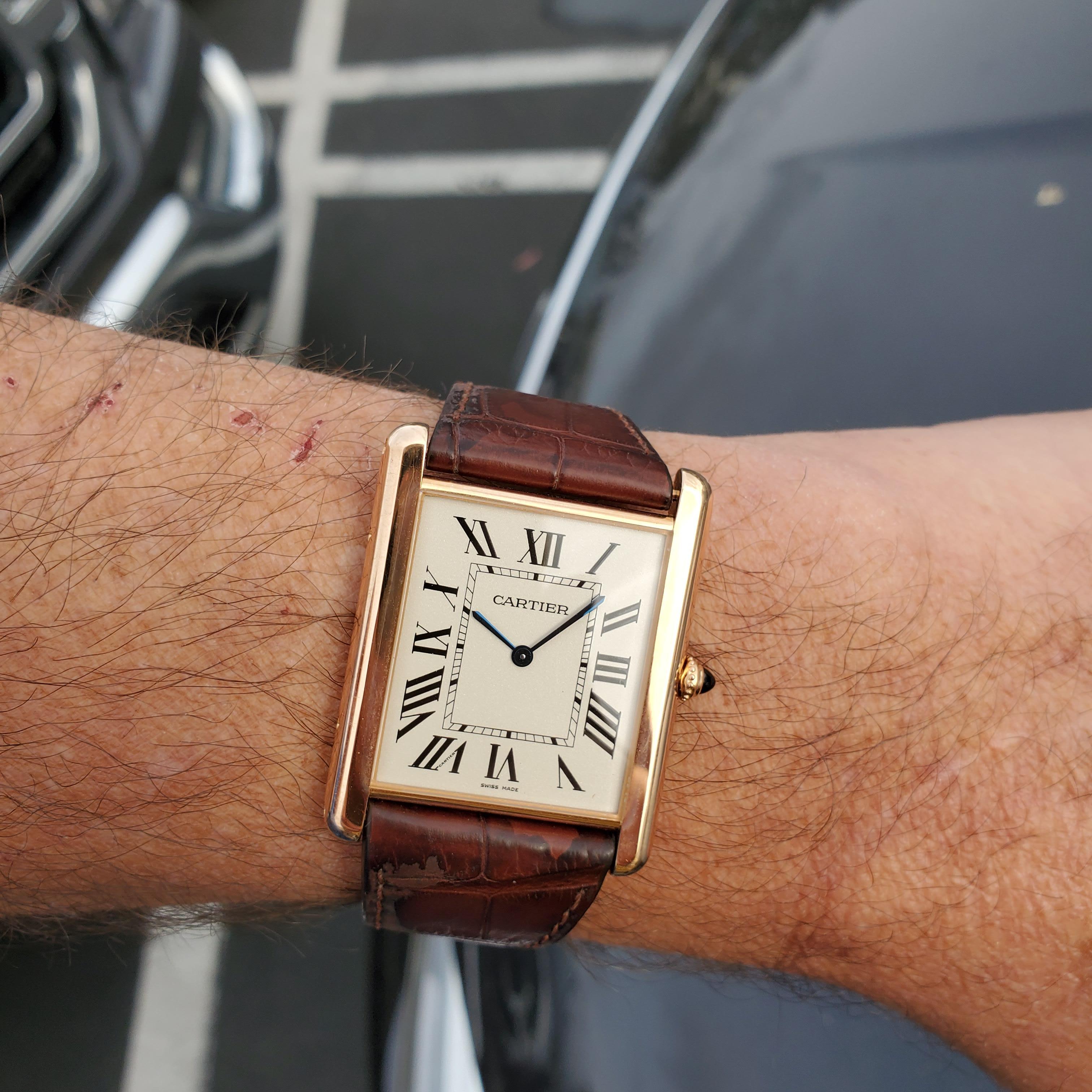Cartier Tank Louie, Grand XL Ref. 3280 Rose gold watch,   The watch is made in 18K rose gold and measuring 32 x 40 mm with manual wind extra thin movement.  The dial is a stippled silvered with black roman numerals.  The watch has an custom brown