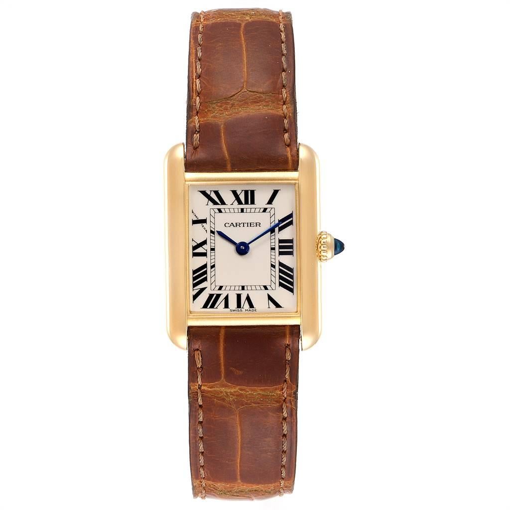 Cartier Tank Louis 18k Yellow Gold Brown Strap Ladies Watch W1529856. Quartz movement. 18k yellow gold case 29.0 x 22.0 mm. Circular grained crown set with the blue sapphire cabochon. Scratch resistant sapphire crystal. Silvered grained dial.