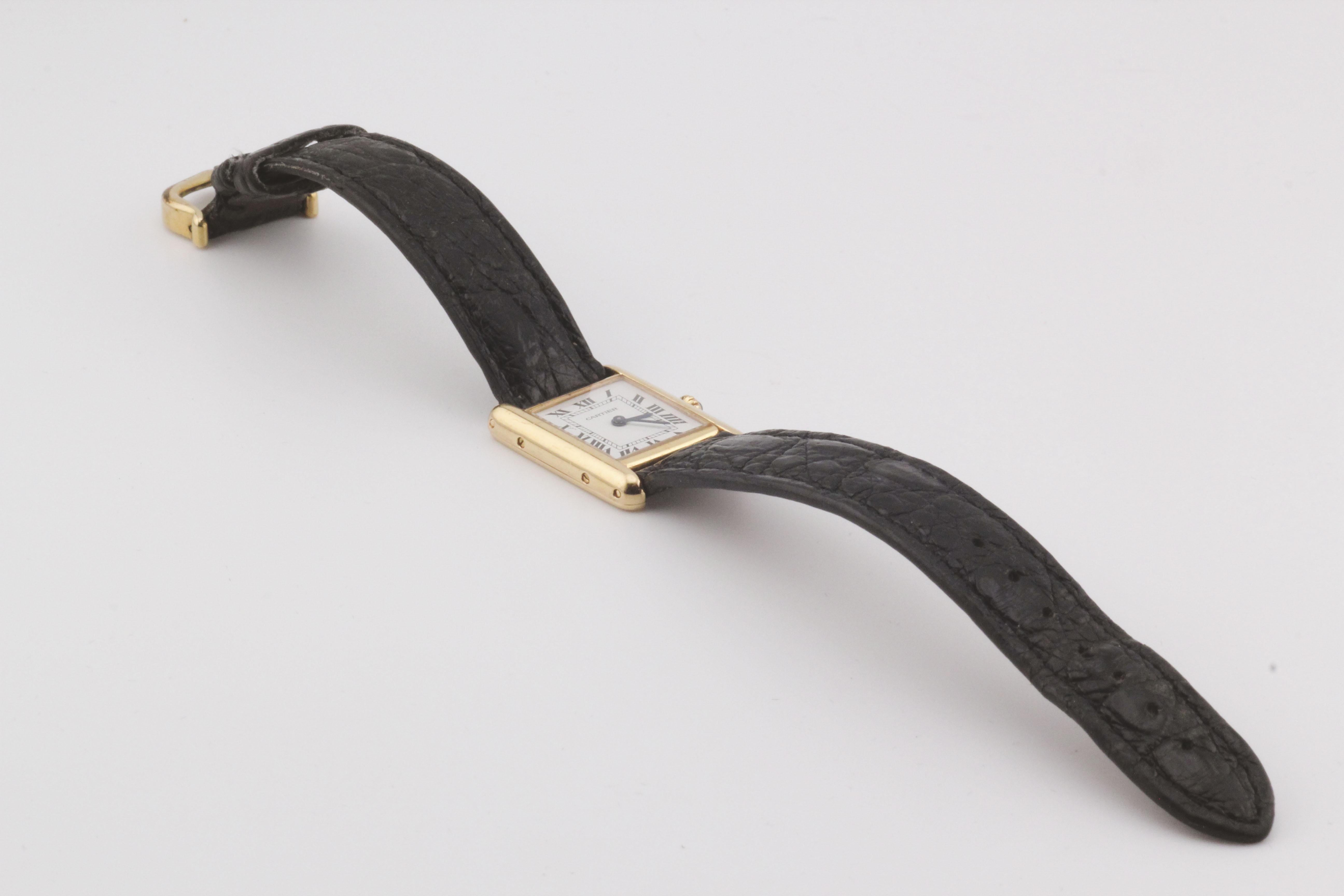 The Cartier Tank Louis 18k Yellow Gold Watch is a timeless symbol of elegance and sophistication. Measuring 27mm x 20mm, its rectangular case, crafted from 18k yellow gold, showcases the refined proportions and clean lines that have defined the Tank