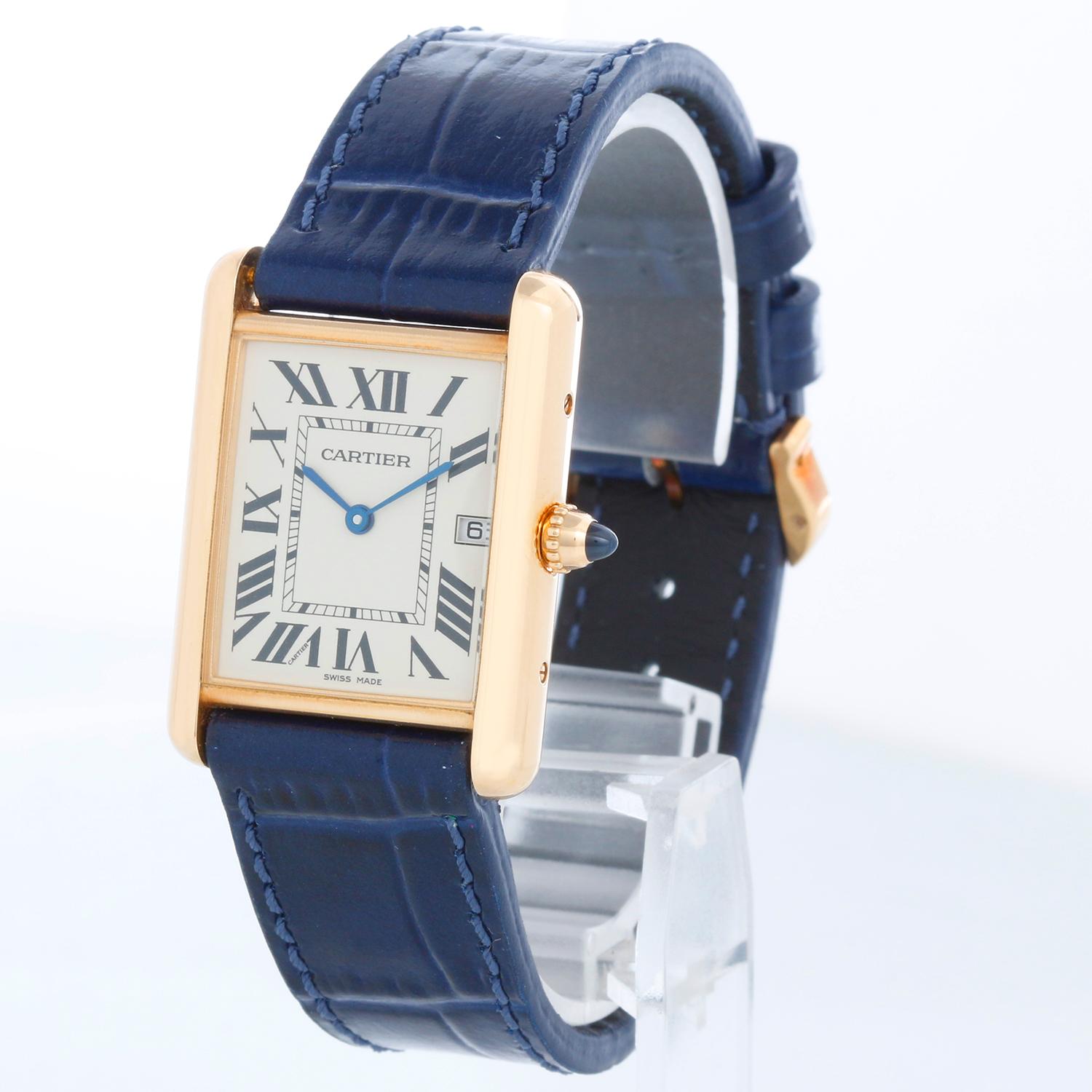 Cartier Tank Louis 18K Yellow Unisex Gold Watch W1529756 2441 - Quartz. 18K Yellow Gold ( 26 x 34 mm ). Flat Ivory dial with Roman numerals; date at 3 o'clock. Blue strap with Cartier tang gold buckle. Pre-owned with custom box.