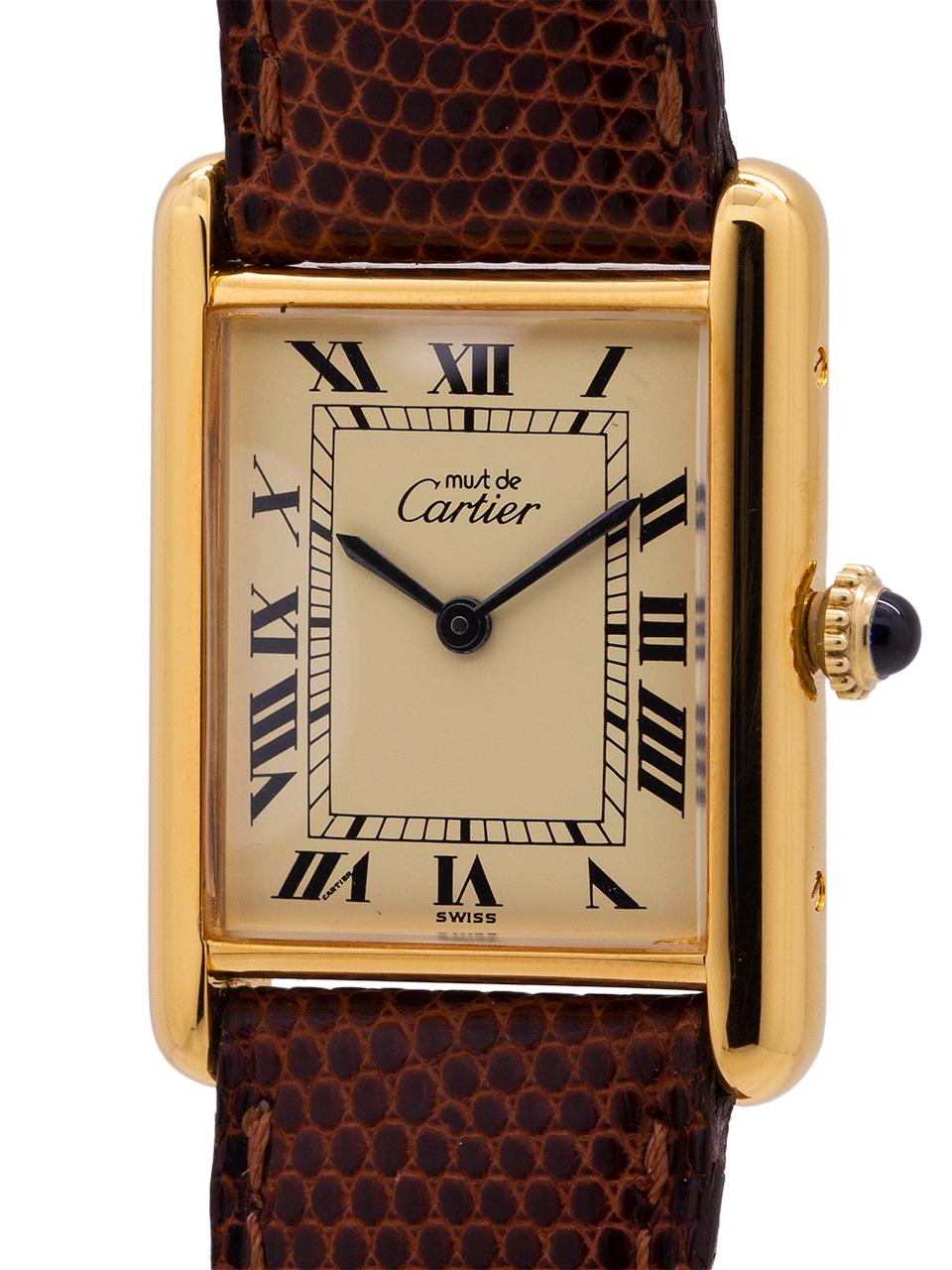 
Cartier man’s Tank Louis circa 1990s. Featuring 24 x 30mm vermeil (20 microns gold over silver) case secured by 4 side and 4 case back screws. Featuring classic cream color dial signed Must de Cartier with printed black Roman numerals and blued