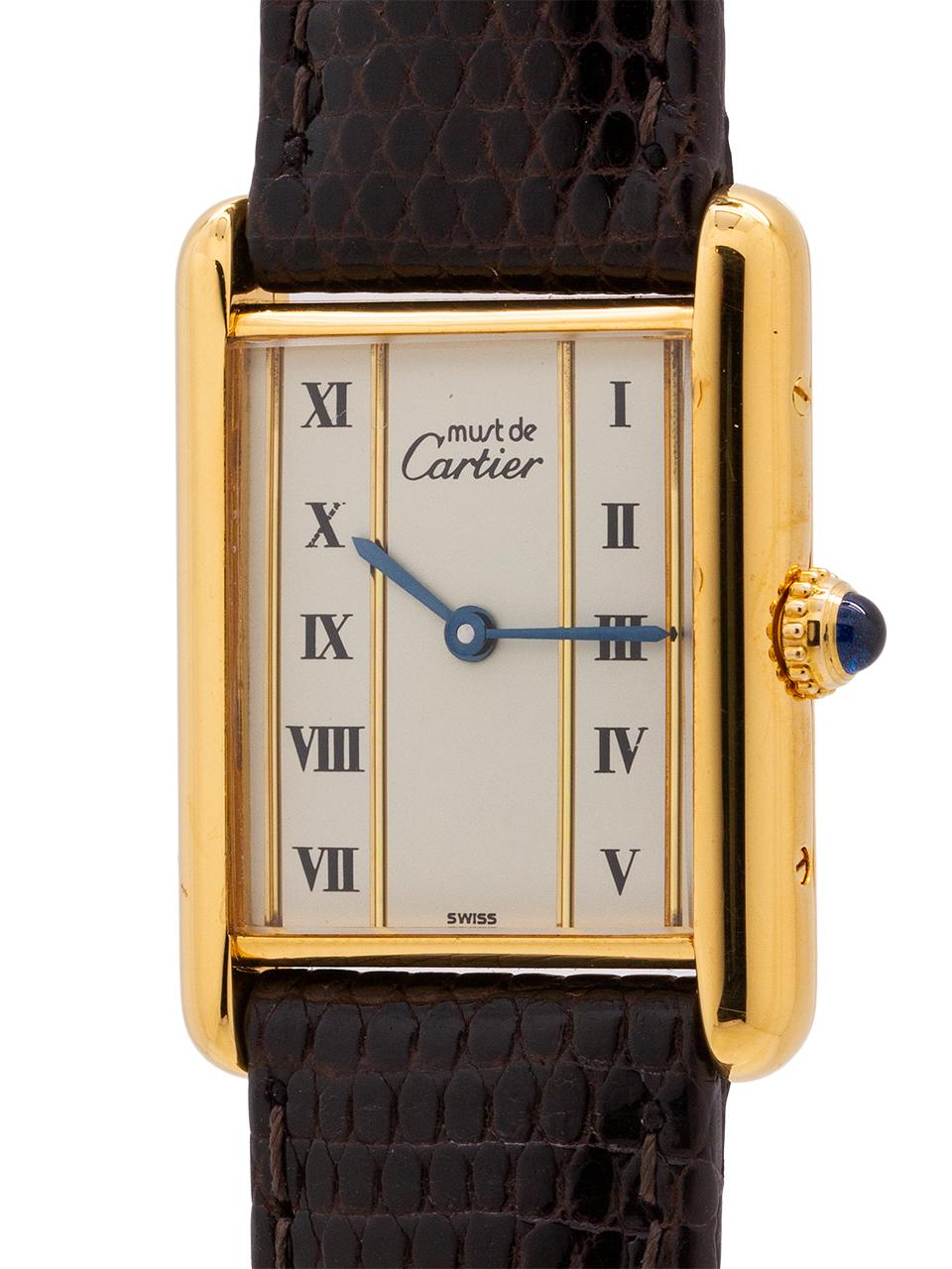 
Cartier Man’s Tank Louis circa 1990s. Featuring 24 x 30mm vermeil (20 microns gold over silver) case secured by 4 side and 4 case back screws. Featuring original, and very interesting, white dial signed Must de Cartier with painted black roman