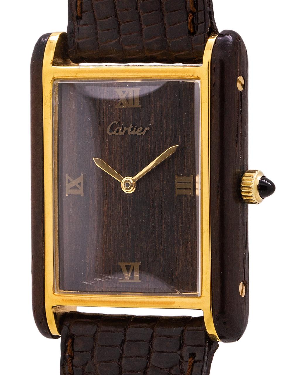 
Scarce 1970’s era Cartier man’s Tank Louis with wood dial and side case panels in exceptional condition with original strap and buckle.  Featuring a smallish man’s 24.5 X 29mm gold plated case with full Cartier signature and numbers on caseback.