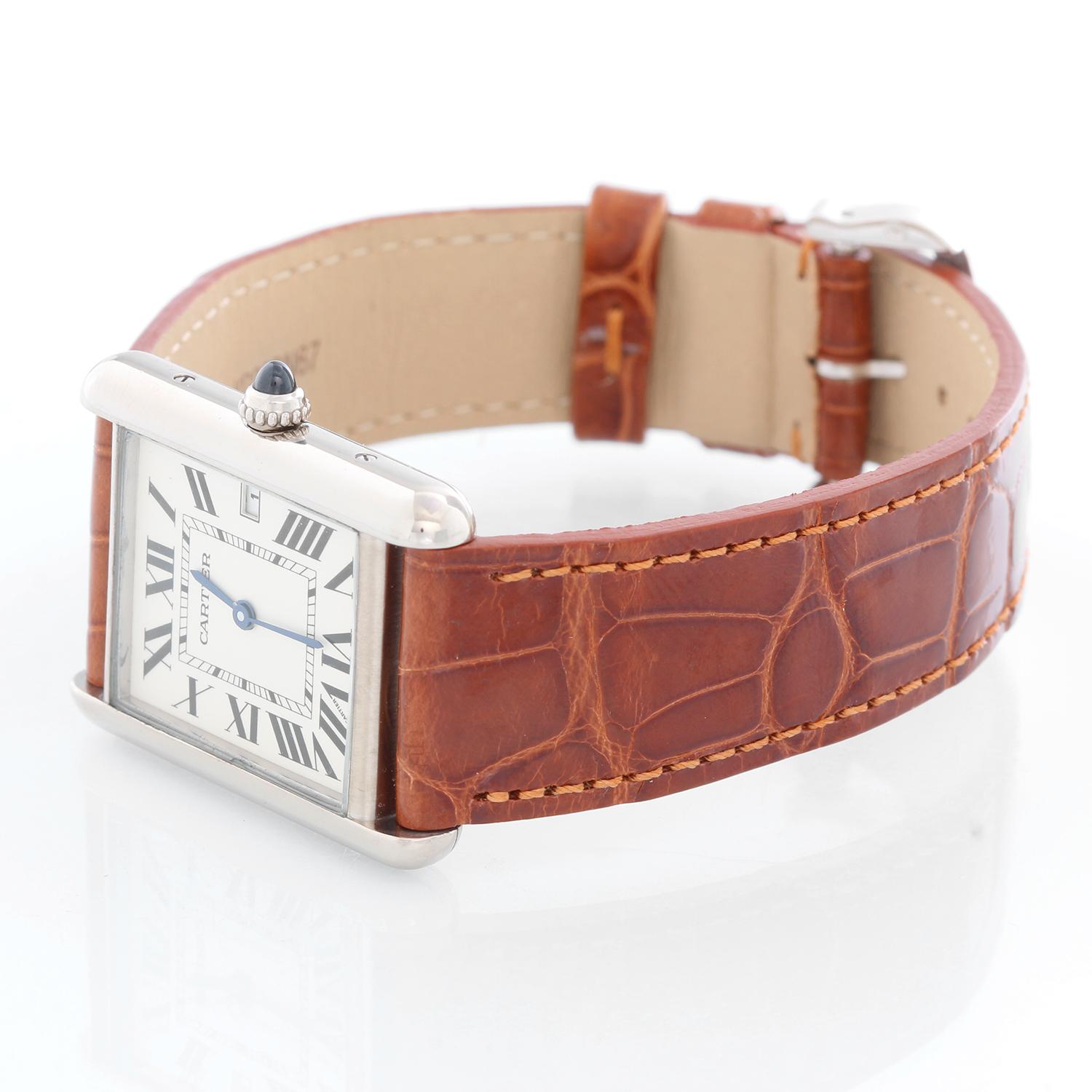 Cartier Tank Louis Men's Watch Ref 2678 - Quartz. 18K White Gold case (26mm x 34mm). Silver guilloche dial with black Roman numerals and date at 3 0'clock. Brown croc strap band and 18k white gold tang buckle. Pre-owned with custom box. 