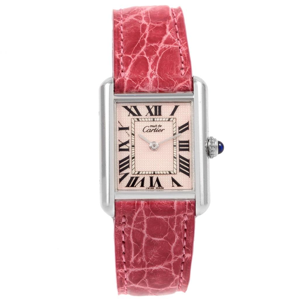 Cartier Tank Louis Must Silver Rose Strap Ladies Watch. Quartz movement. Silver rectangular case 21.7 x 29.3 mm. Circular grained crown set with the blue spinel cabochon. Scratch resistant sapphire crystal. Pink dial with black roman numerals. Pink