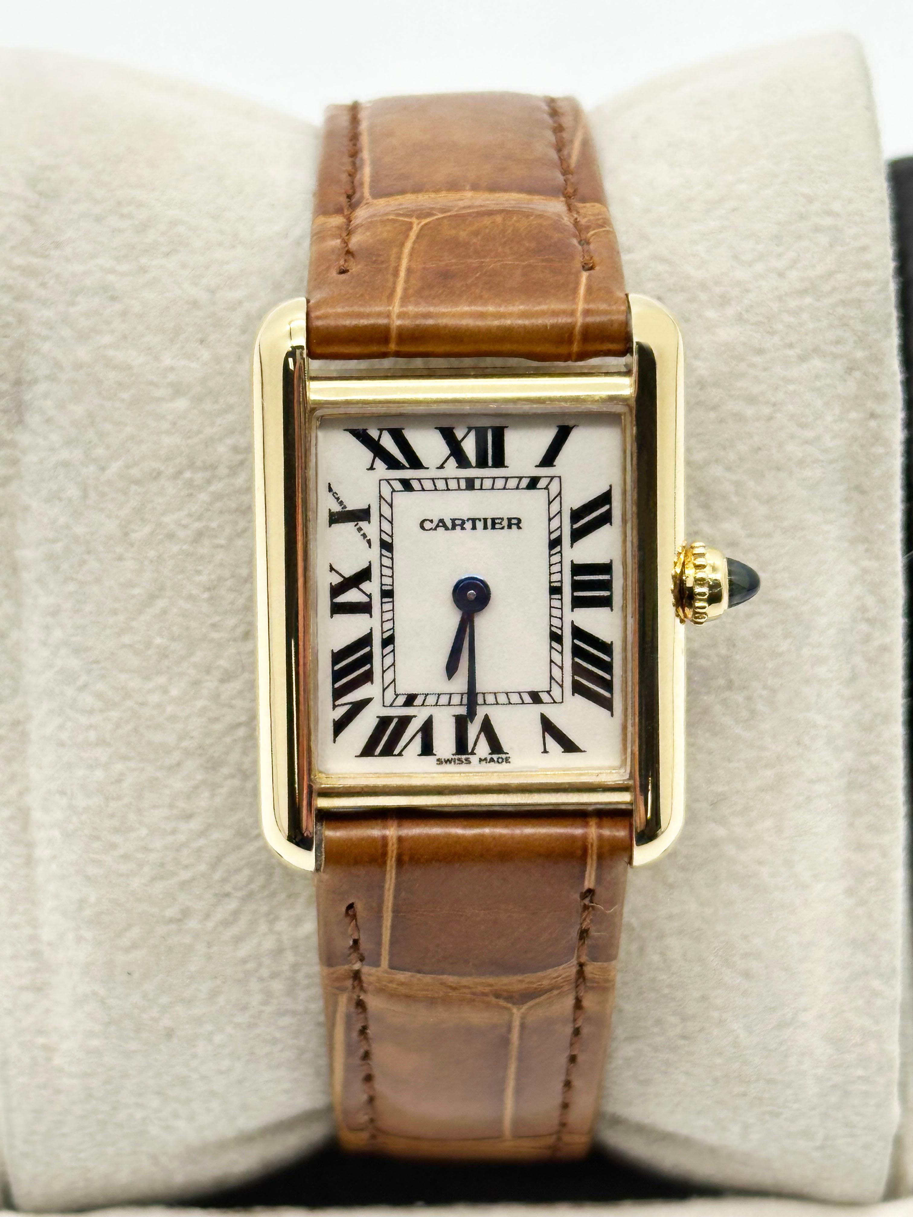 Style Number: 2442

 

Model: Tank Louis 

 

Case Material: 18K Yellow Gold

 

Band: Leather 

 

Bezel:  18K Yellow Gold

 

Dial: Ivory / White

 

Face: Sapphire Crystal 

 

Case Size: 22mm x 29mm 

 

Includes: 

-Elegant Watch Box

-Service