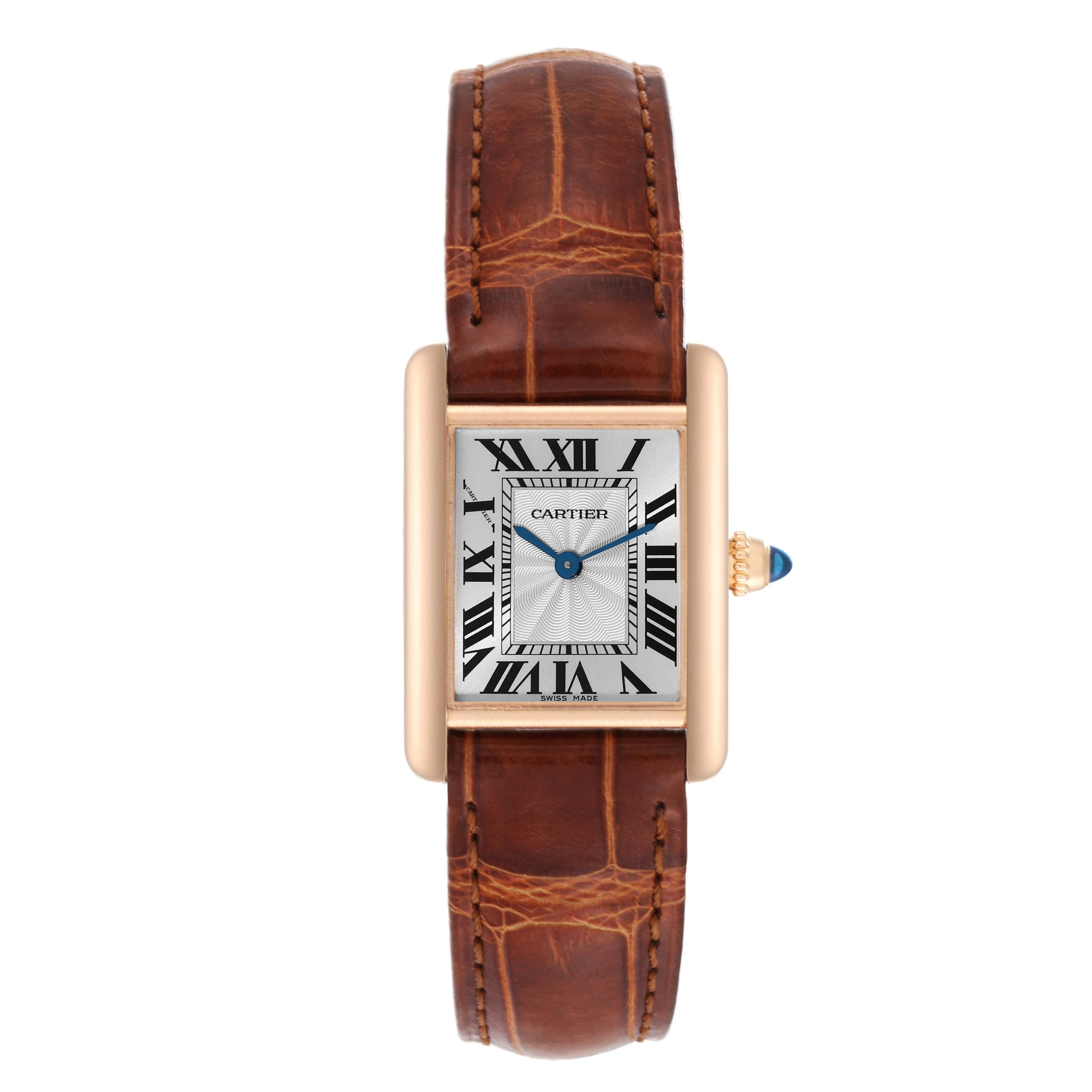 Cartier Tank Louis Rose Gold Mechanical Ladies Watch WGTA0010 Papers. Manual winding movement. 18k rose gold case 29.5 x 22.0 mm. Circular grained crown set with the blue sapphire cabochon. . Scratch resistant sapphire crystal. Silvered guilloche