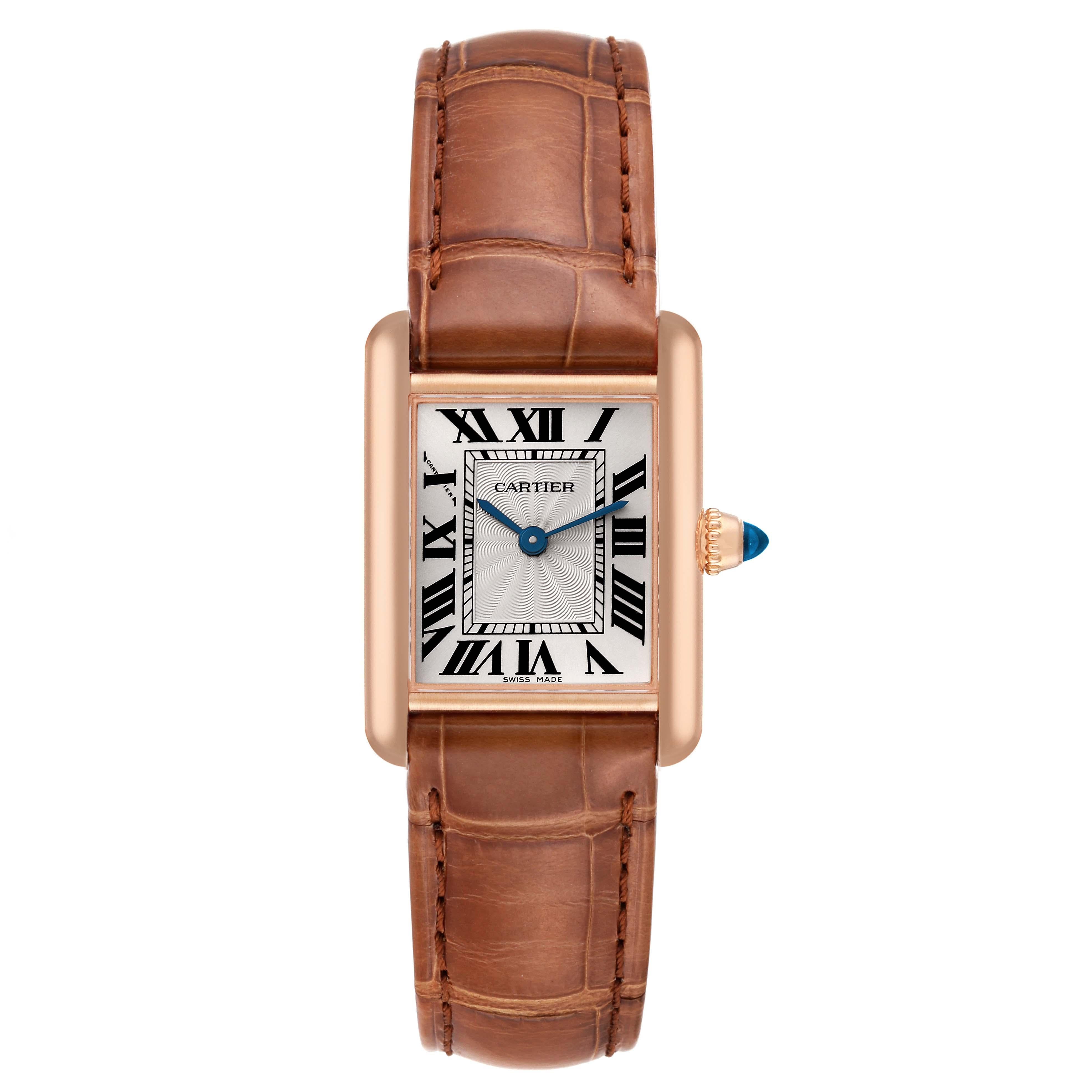 Cartier Tank Louis Rose Gold Mechanical Ladies Watch WGTA0010 Papers. Manual winding movement. 18k rose gold case 29.5 x 22.0 mm. Circular grained crown set with the blue sapphire cabochon. . Mineral crystal. Silvered guilloche dial with black Roman