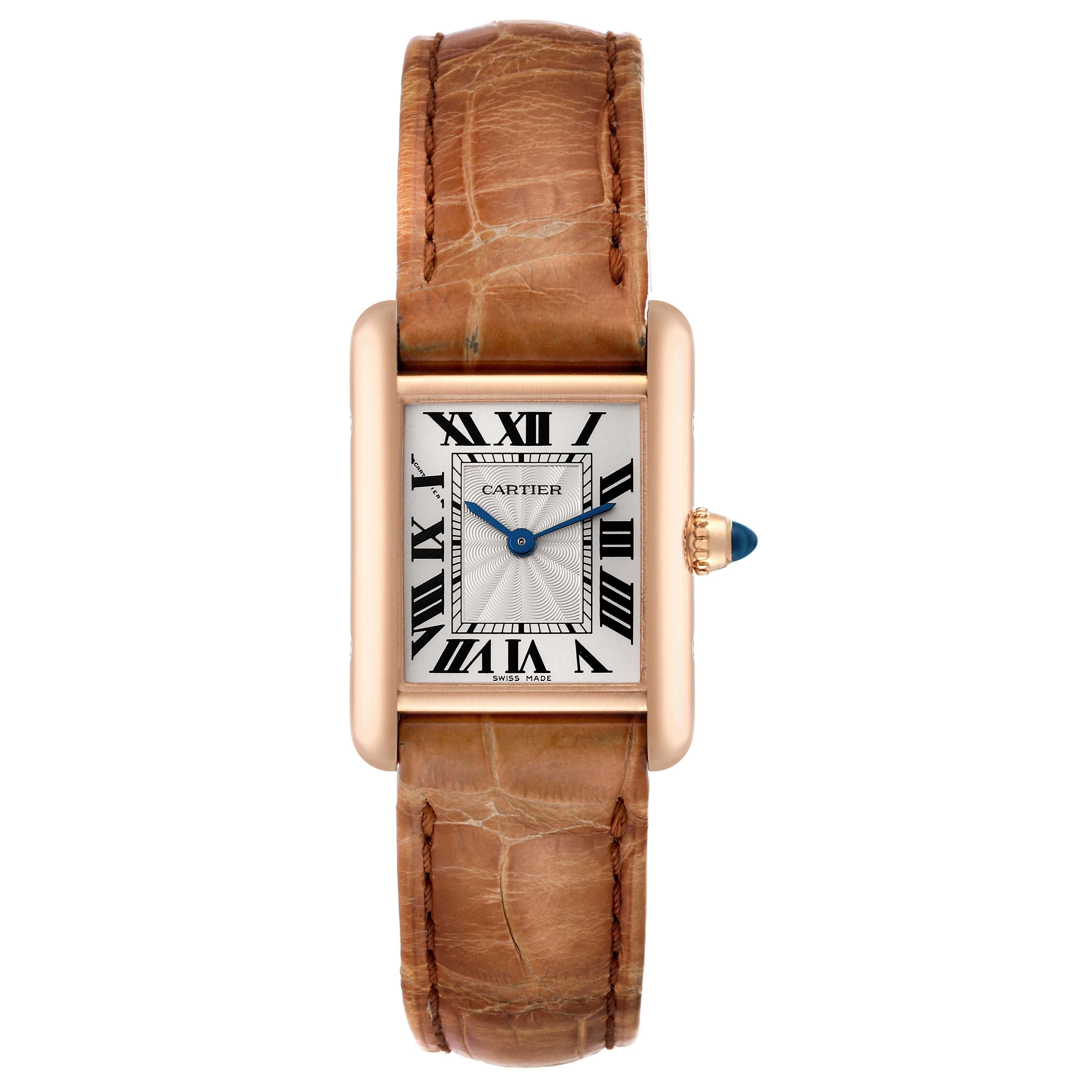 Cartier Tank Louis Rose Gold Mechanical Ladies Watch WGTA0010 Papers. Manual winding movement. 18k rose gold case 29.5 x 22.0 mm. Circular grained crown set with a blue sapphire cabochon. . Mineral crystal. Silvered guilloche dial with black Roman