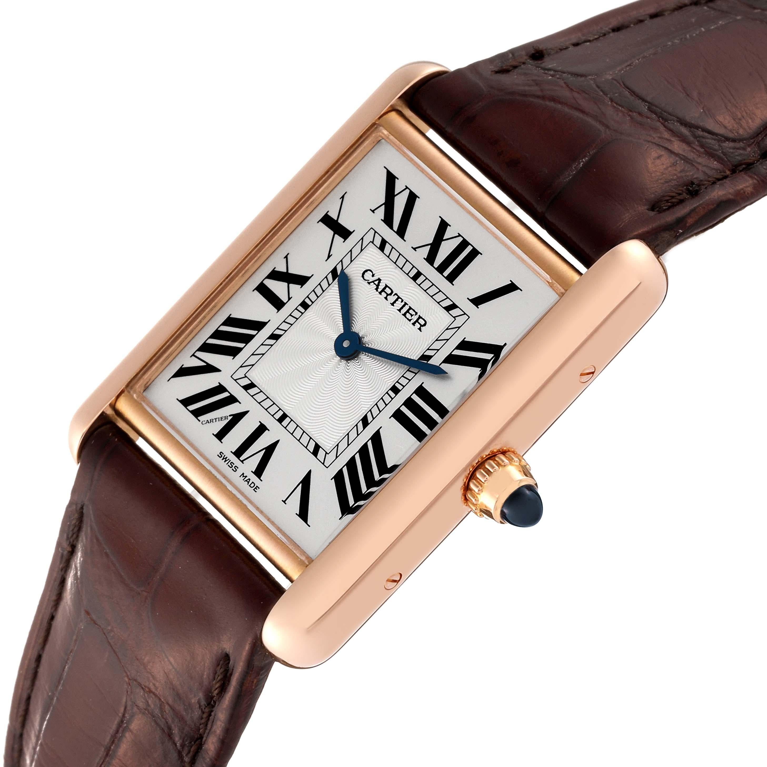 Cartier Tank Louis Rose Gold Mechanical Mens Watch WGTA0011 Box Card. Manual winding movement. 18k rose gold case 25 mm x 33 mm. Circular grained crown set with a blue sapphire cabochon. . Mineral crystal. Silvered guilloche dial with black Roman