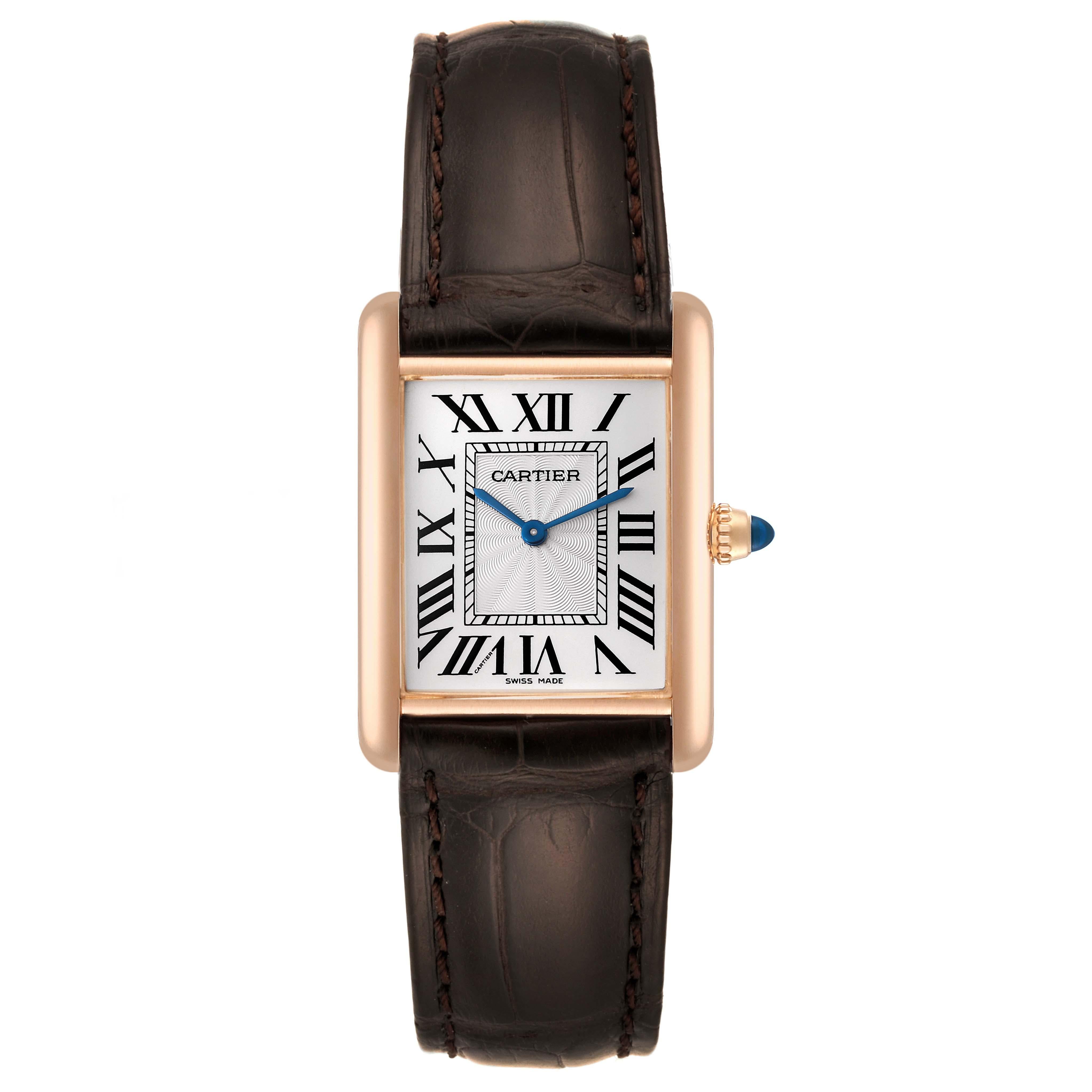 Cartier Tank Louis Rose Gold Mechanical Mens Watch WGTA0011 Card. Manual winding movement. 18k rose gold case 25 mm x 33 mm. Circular grained crown set with a blue sapphire cabochon. . Mineral crystal. Silvered guilloche dial with black Roman