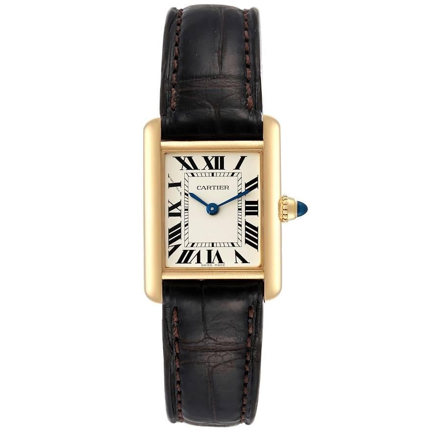 Cartier Tank Louis Small Yellow Gold Brown Strap Ladies Watch W1529856 Card. Quartz movement. 18k yellow gold case 29.0 x 22.0 mm. Circular grained crown set with a blue sapphire cabochon. . Scratch resistant sapphire crystal. Silvered grained dial