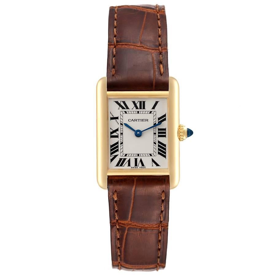 Cartier Tank Louis Small Yellow Gold Brown Strap Ladies Watch W1529856. Quartz movement. 18k yellow gold case 29.0 x 22.0 mm. Circular grained crown set with a blue sapphire cabochon. . Scratch resistant sapphire crystal. Silvered grained dial with