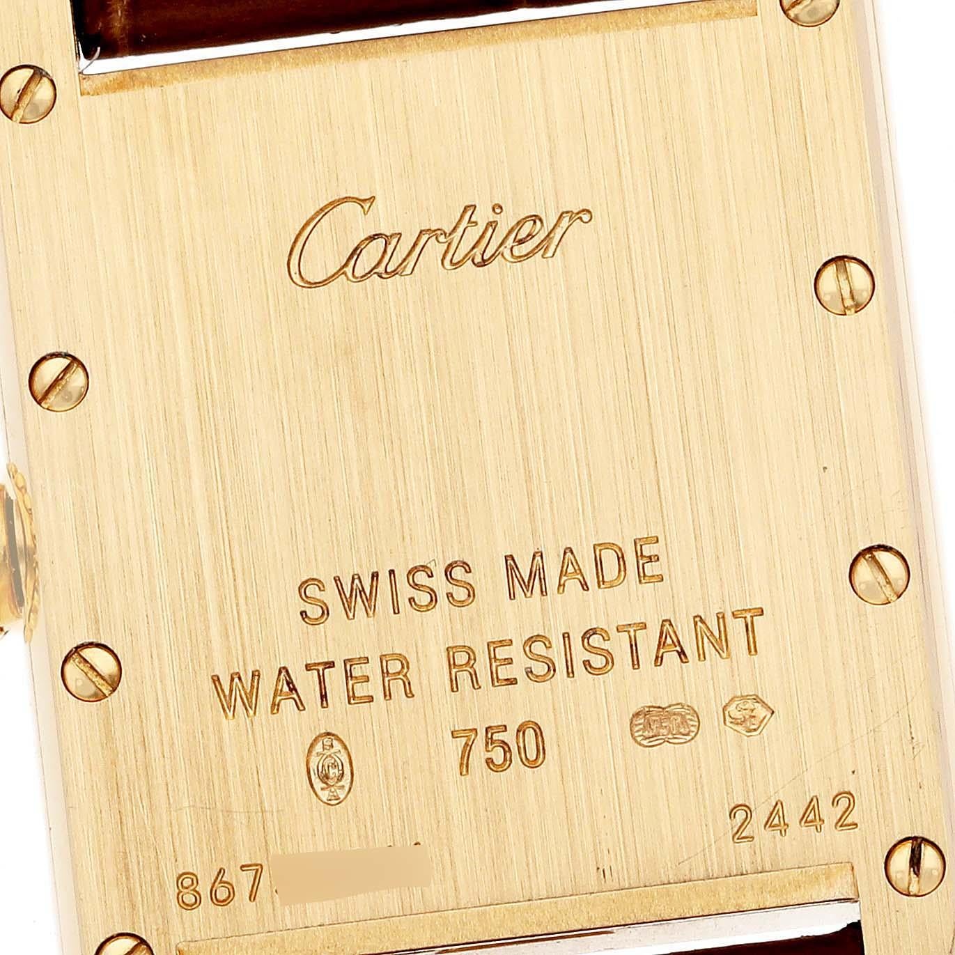 Cartier Tank Louis Small Yellow Gold Brown Strap Ladies Watch W1529856 Papers. Quartz movement. 18k yellow gold case 29.0 x 22.0 mm. Circular grained crown set with a blue sapphire cabochon. . Scratch resistant mineral crystal. Silvered grained dial