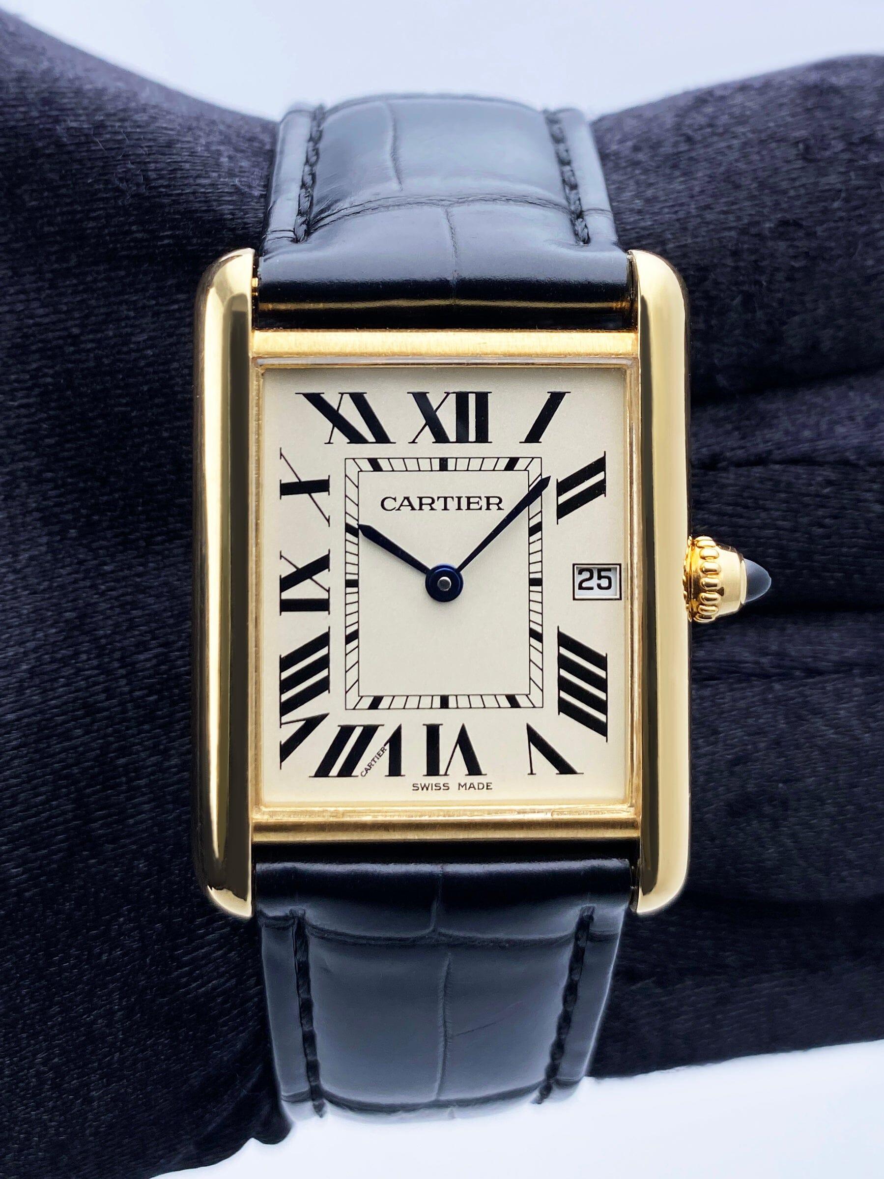 Cartier Tank Louis W1529756 / 2441 Mens Watch. 25.5mm 18K yellow gold case. Off-white dial with blue hands and black Roman numeral hour markers. Minute markers on the inner dial. Date display at 3 o'clock position. Black leather strap with 18K
