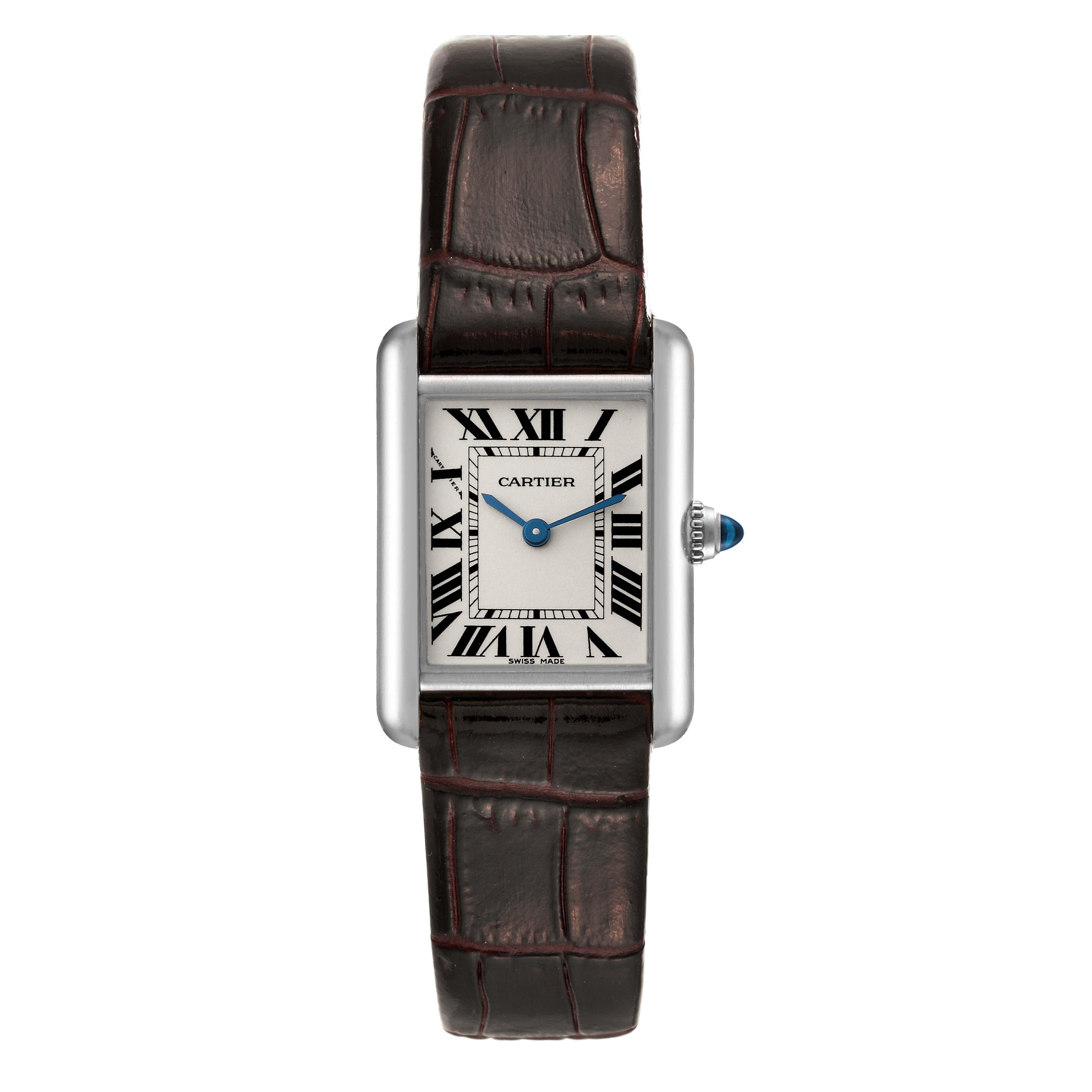 Cartier Tank Louis White Gold Brown Strap Ladies Watch W1541056. Quartz movement. 18K white gold case 22 mm x 29 mm. Circular grained crown set with a blue sapphire cabochon. . Scratch resistant sapphire crystal. Silver grained dial with black Roman