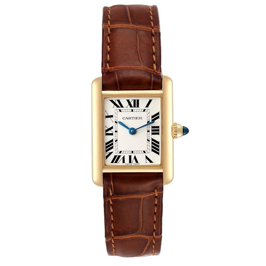 Cartier Tank Louis Yellow Gold Brown Strap Ladies Watch W1529856 Box Card. Quartz movement. 18k yellow gold case 29.0 x 22.0 mm. Circular grained crown set with the blue sapphire cabochon. . Scratch resistant sapphire crystal. Silvered grained dial.