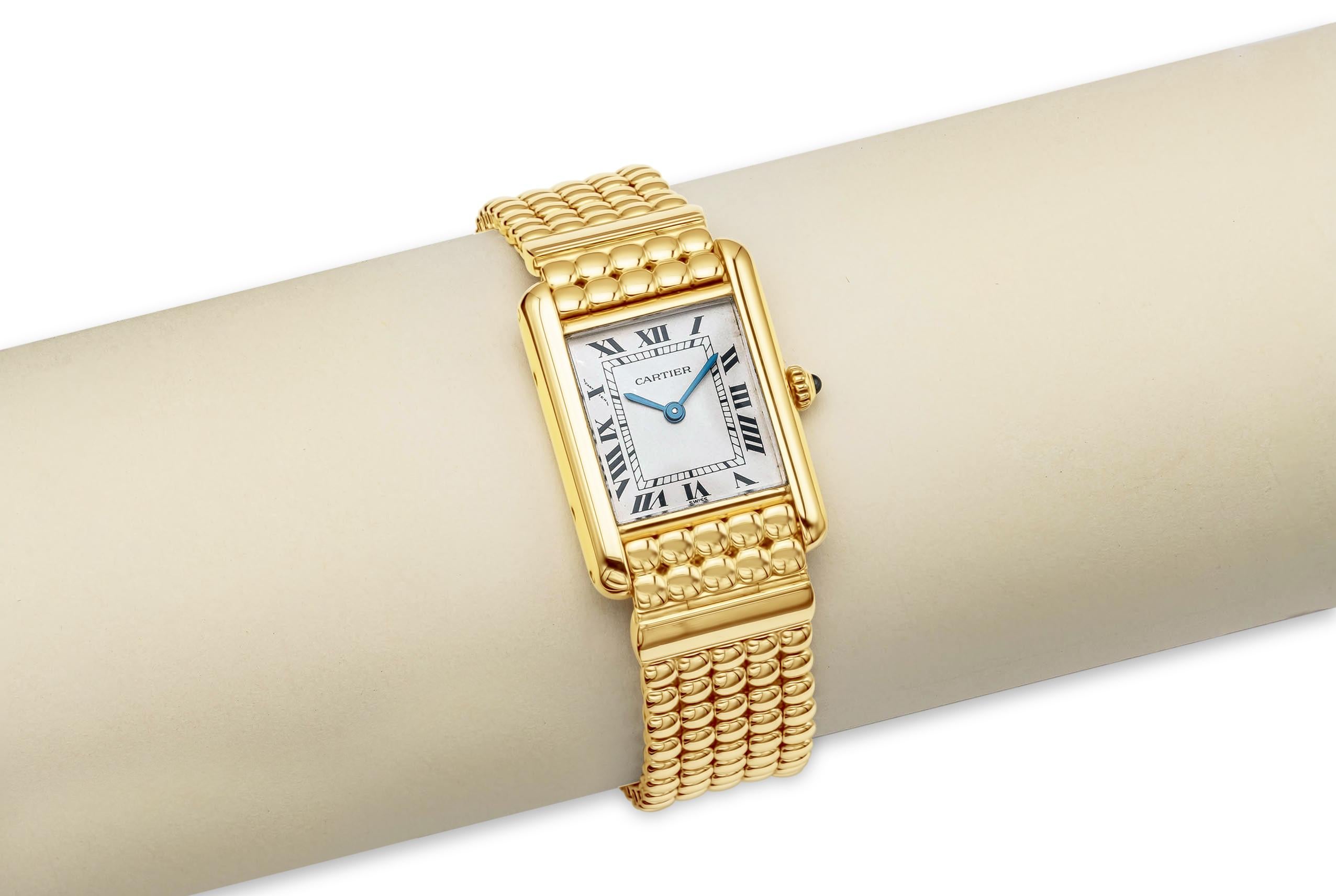 Case: Square case measuring 21mm x 28mm (lug to lug). Made in 18k yellow gold. Screw case back engraved 