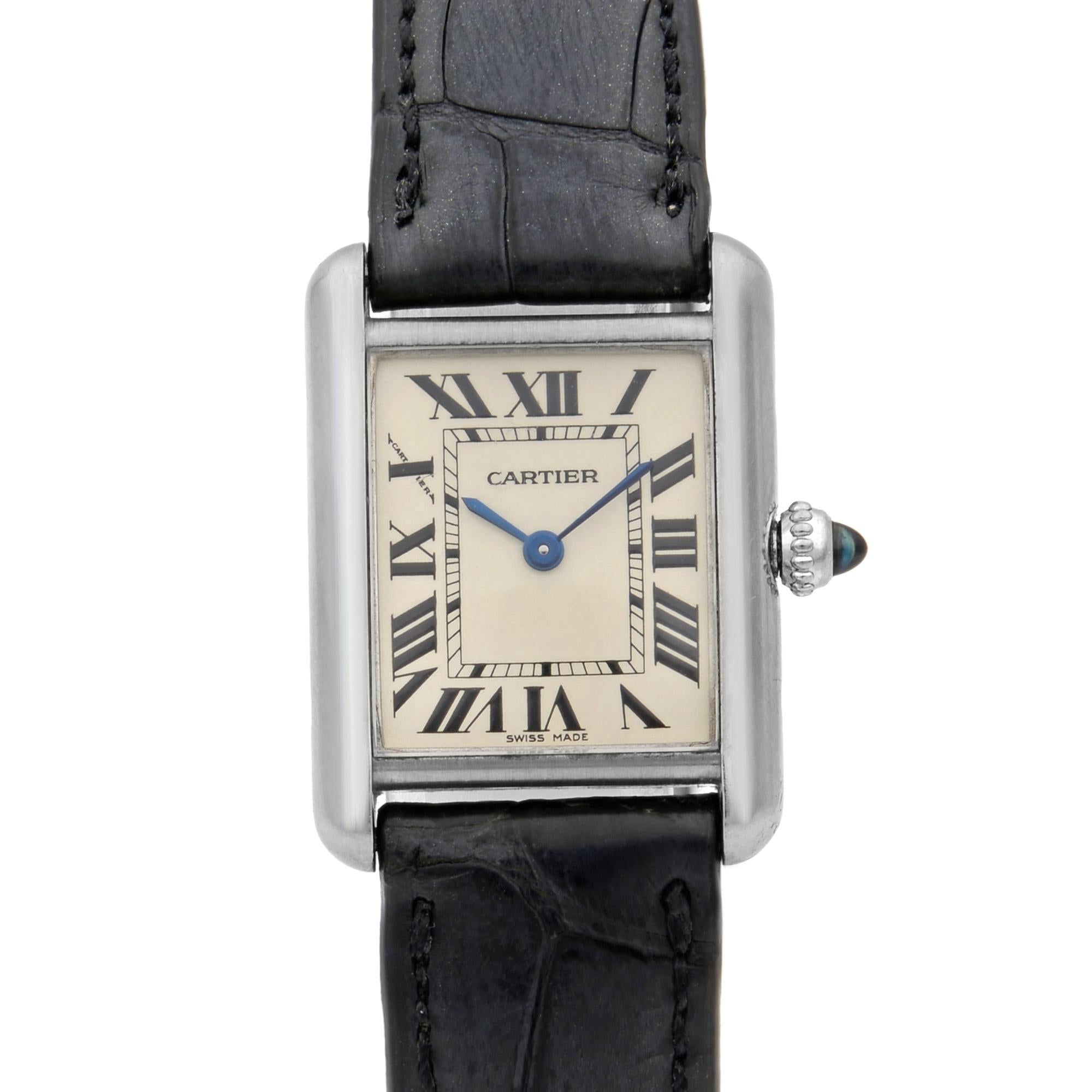 This pre-owned Cartier Tank W1541056 is a beautiful men's timepiece that is powered by quartz (battery) movement which is cased in a white gold case. It has a  rectangle shape face,  dial and has hand roman numerals style markers. It is completed