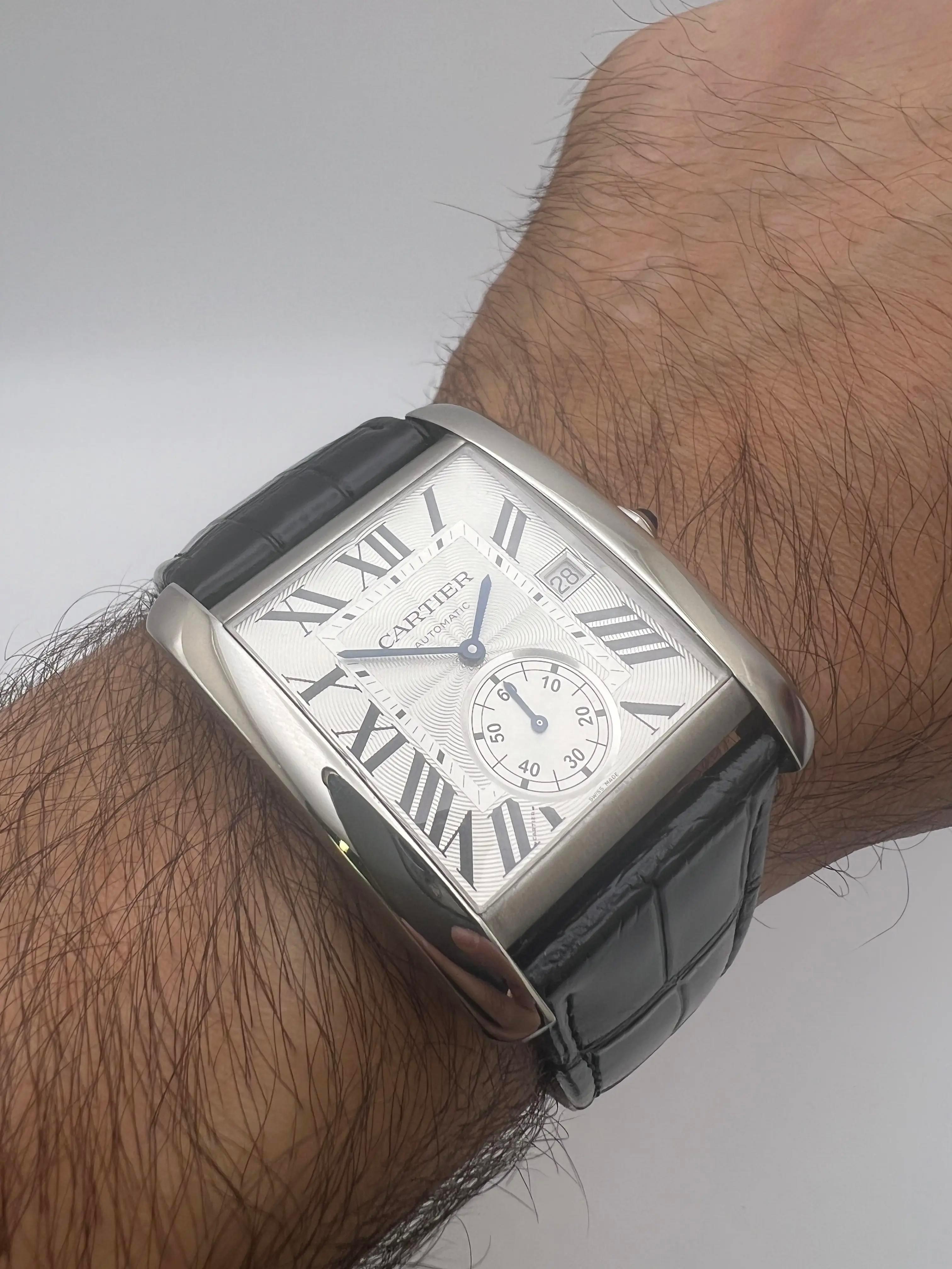Pristine condition Cartier Tank MC, reference W5330003, featuring a classic silvered guilloché dial. This elegant timepiece showcases a stainless steel case measuring 44mm x 34.3mm, embodying Cartier's iconic rectangular design with harmonious