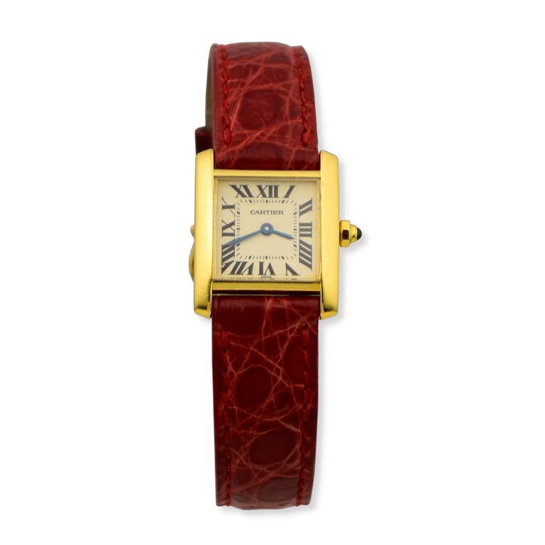 Brand: Cartier 
Model Name:  Tank Montres  
Movement: Quartz
Case Size: 20 mm
Case Back: Solid 
Case Material: 18k Yellow Gold 
Bezel: 18k Yellow Gold 
Dial: Cream 
Bracelet:  Red Leather 
Hour Markers: Roman Numerals   
Features: Hours, Minutes,