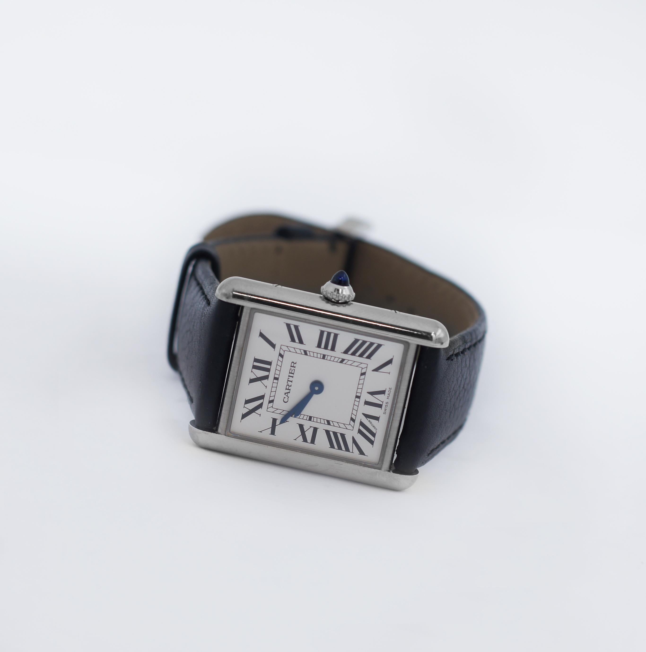 CARTIER TANK MUST WATCH
large model
high autonomy quartz movement
Steel case
beaded crown set with a synthetic cabochon-shaped spinel
silvered dial
blued-steel sword-shaped hands
interchangeable black grained calfskin strap
steel ardillon