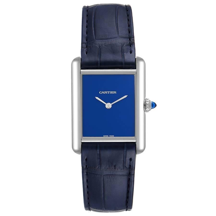 Cartier Tank Must Large Steel Blue Dial Ladies Watch WSTA0055. Quartz movement. Stainless steel case 33.7 x 25.5 mm. Circular grained crown set with the blue spinel cabochon. . Scratch resistant sapphire crystal. Blue dial with sword shaped steel