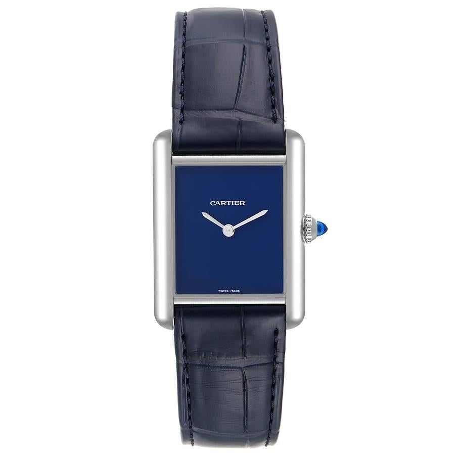 Cartier Tank Must Large Steel Blue Dial Ladies Watch WSTA0055 Unworn. Quartz movement. Stainless steel case 33.7 x 25.5 mm. Circular grained crown set with the blue spinel cabochon. . Scratch resistant sapphire crystal. Blue dial with sword shaped