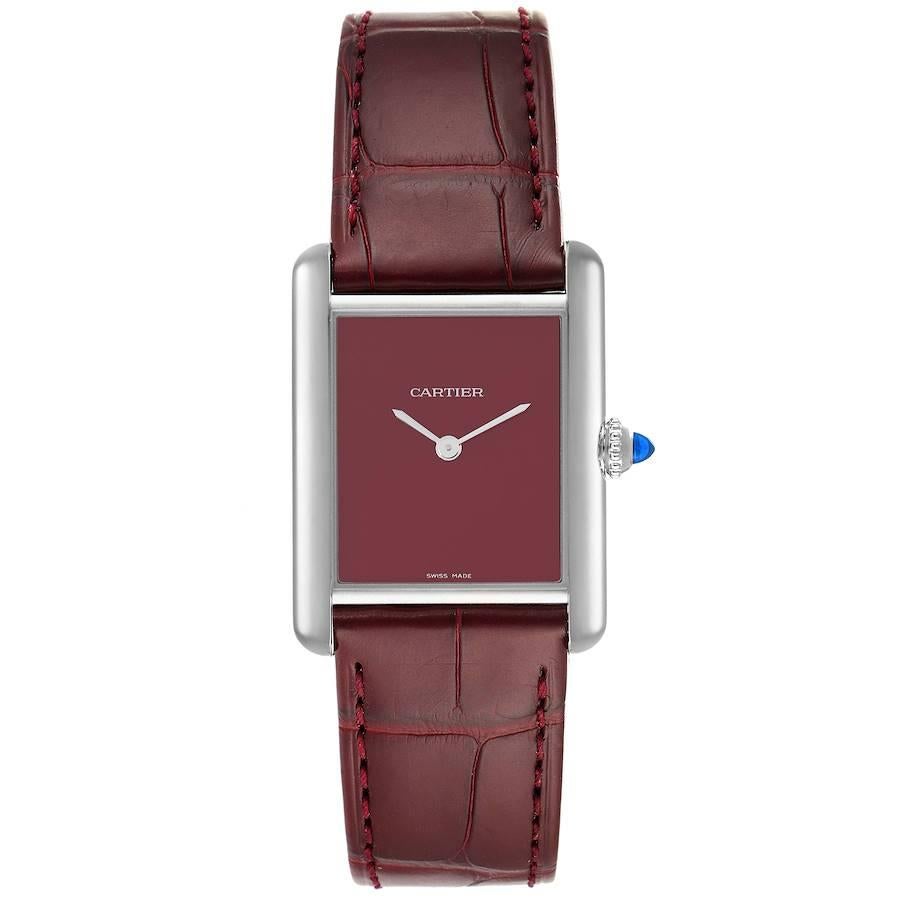 Cartier Tank Must Large Steel Red Dial Ladies Watch WSTA0054 Unworn. Quartz movement. Stainless steel case 33.7 x 25.5 mm. Circular grained crown set with the blue spinel cabochon. . Scratch resistant sapphire crystal. Red dial with sword shaped
