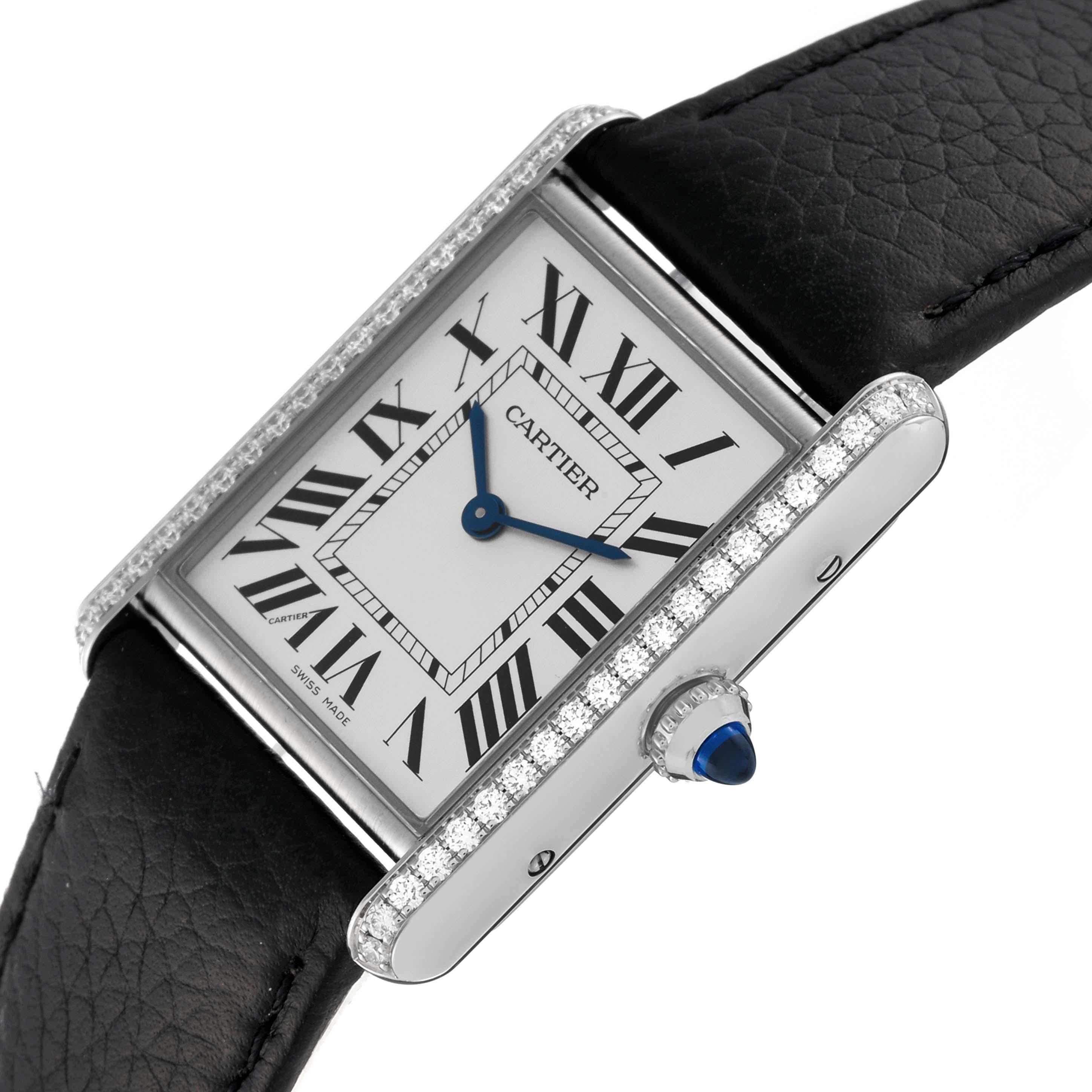 Cartier Tank Must Large Steel Silver Dial Diamond Ladies Watch W4TA0017 Box Card. Quartz movement. Stainless steel case 33.7 x 25.5 mm. Circular grained crown set with a blue spinel cabochon. Original Cartier factory diamond bezel. Scratch resistant