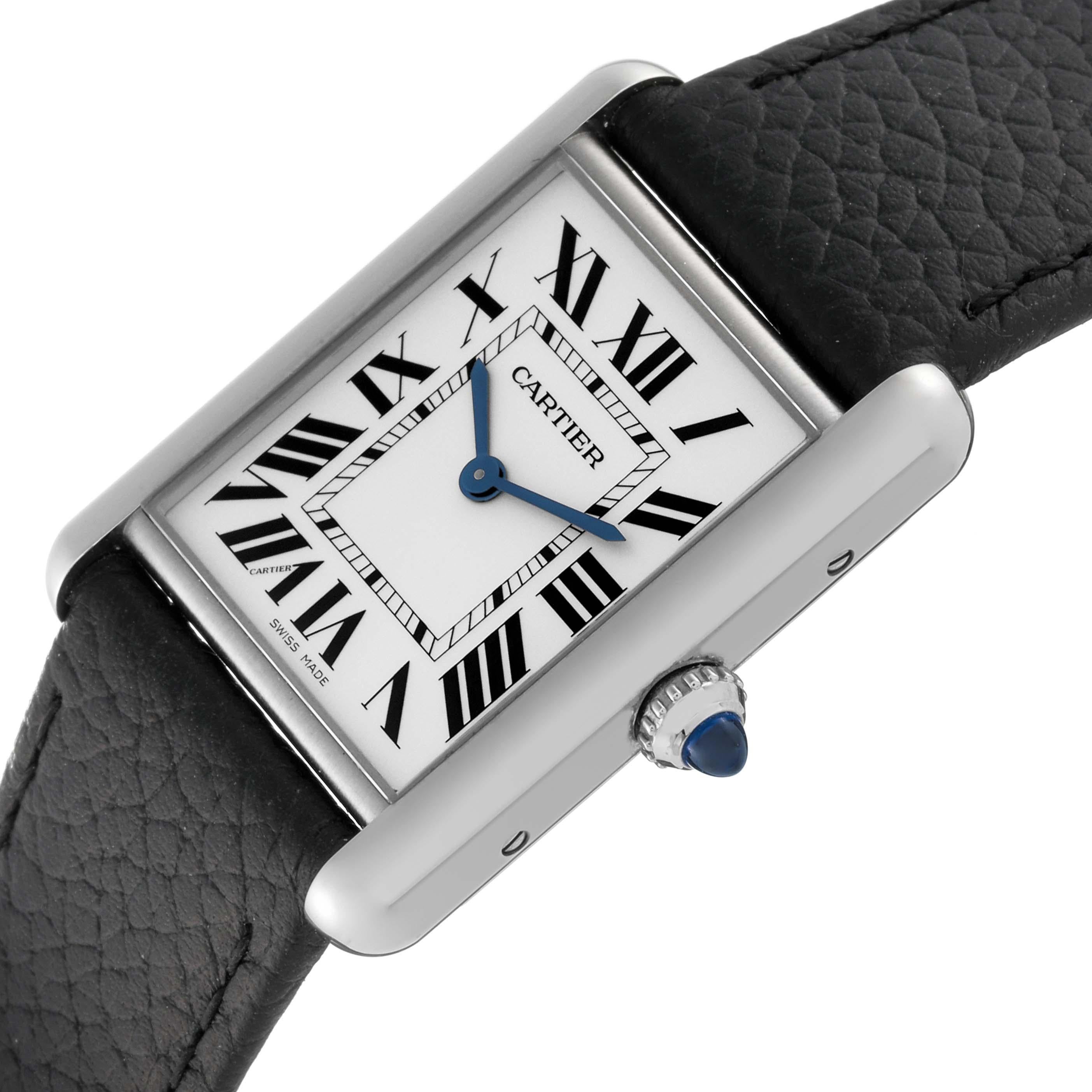 Cartier Tank Must Large Steel Silver Dial Ladies Watch WSTA0041 Box Card. Quartz movement. Stainless steel case 33.7 x 25.5 mm. Circular grained crown set with the blue spinel cabochon. . Scratch resistant sapphire crystal. Silver dial with black