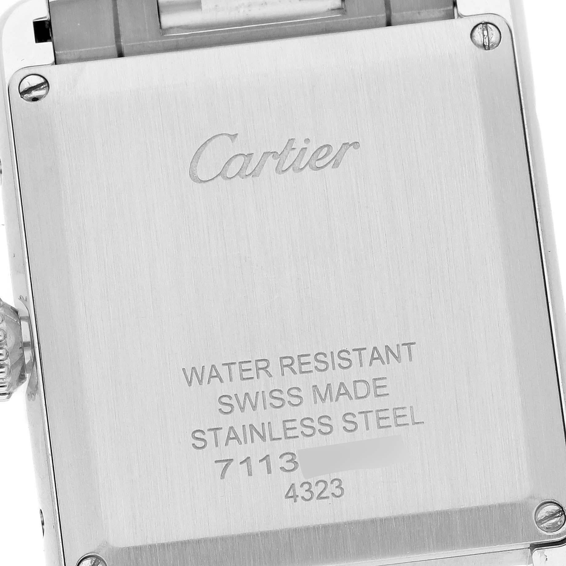Cartier Tank Must Large Steel Silver Dial Ladies Watch WSTA0052. Quartz movement. Stainless steel case 33.7 x 25.5 mm. Circular grained crown set with the blue spinel cabochon. . Scratch resistant sapphire crystal. Silvered dial with black Roman