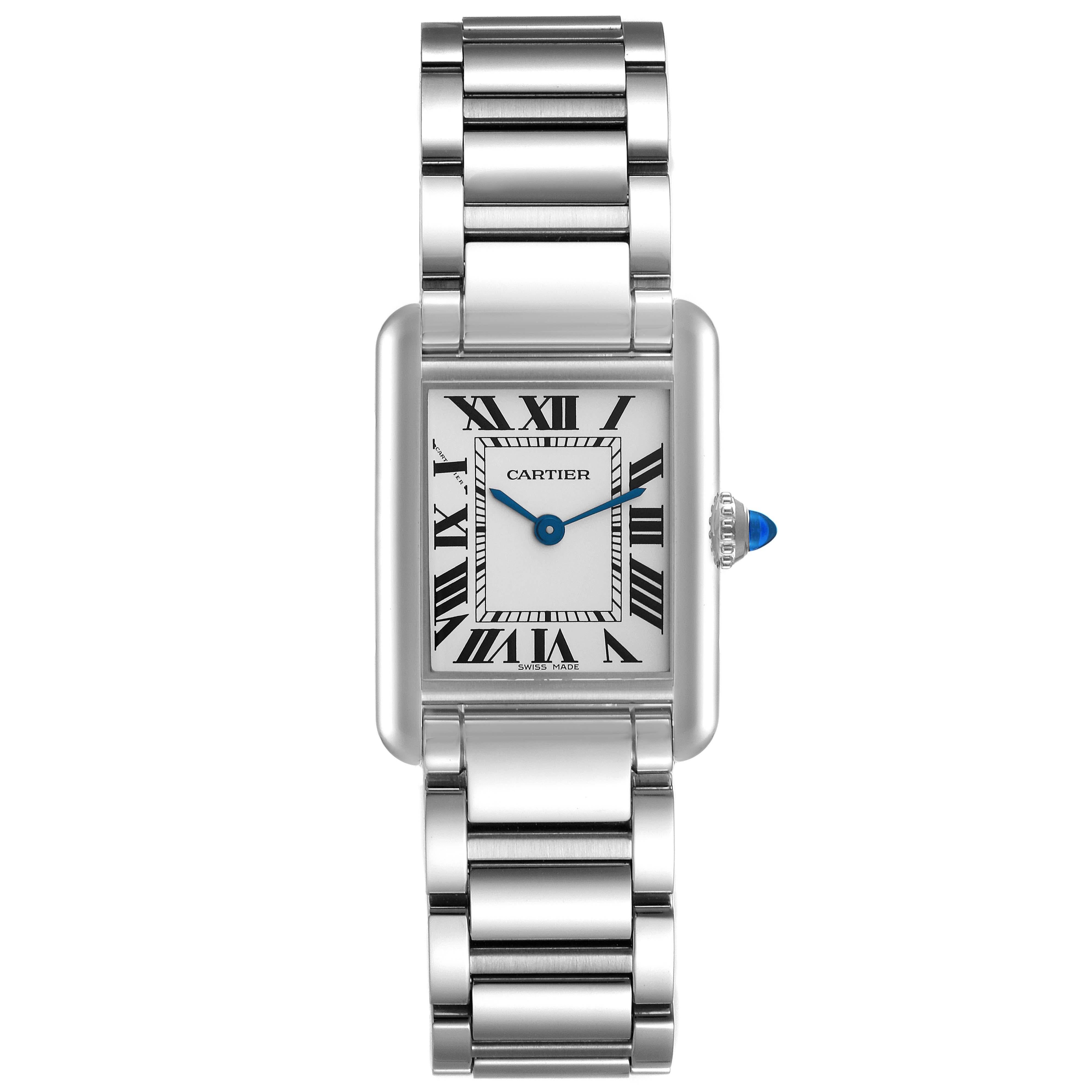 Cartier Tank Must Small Silver Dial Steel Ladies Watch WSTA0051 Box Card. Quartz movement. Stainless steel case 29.5 x 22 mm. Circular grained crown set with a blue spinel cabochon. . Scratch resistant sapphire crystal. Silver dial with black Roman