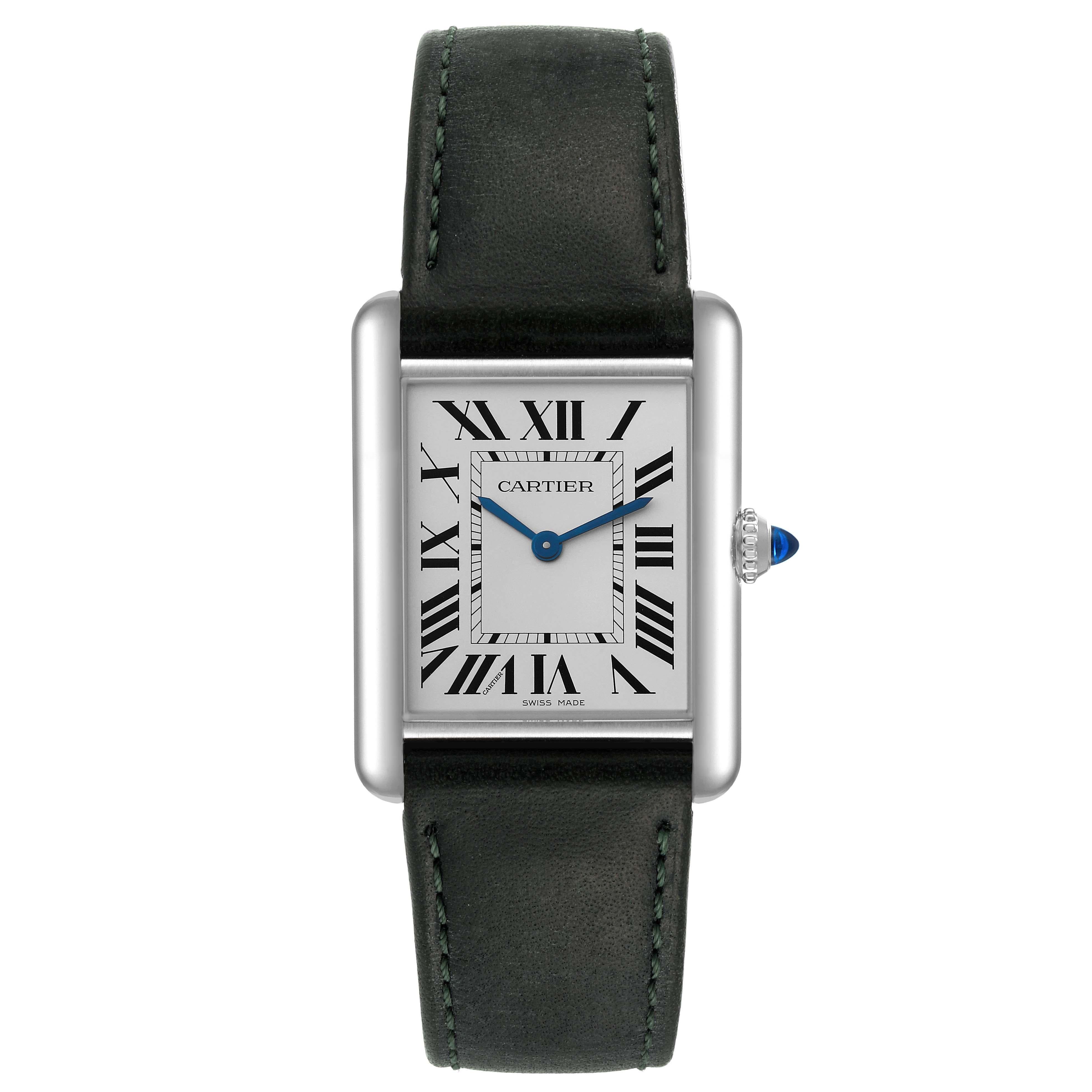 Cartier Tank Must SolarBeat Green Strap Steel Ladies Watch WSTA0062. Quartz movement. Stainless steel case 33.7 x 25.5 mm. Beaded crown set with a synthetic cabochon-shaped blue spinel. . Scratch resistant sapphire crystal. Silvered grained dial