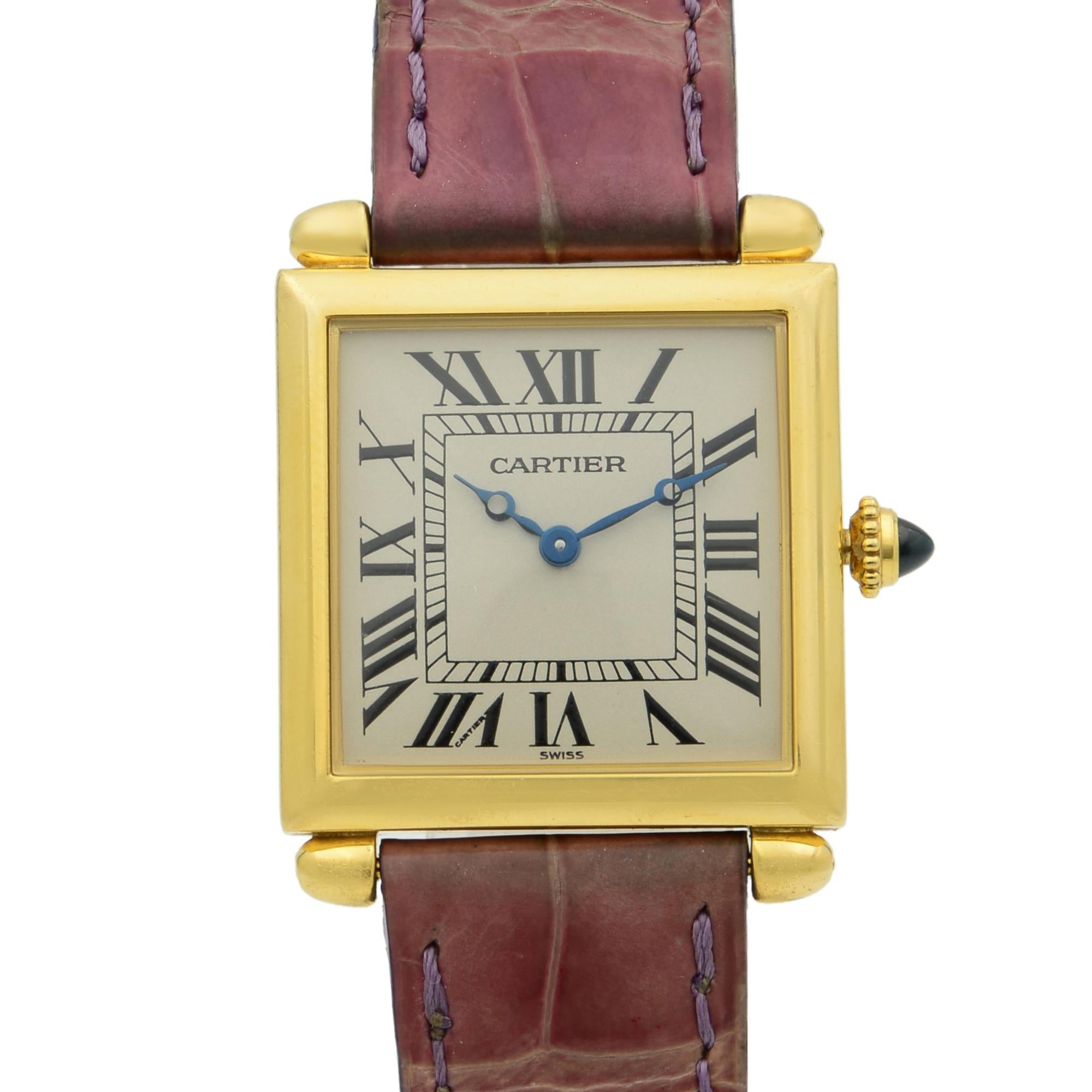 This pre-owned Cartier Tank Obus 1630 is a beautiful Ladie's timepiece that is powered by quartz (battery) movement which is cased in a yellow gold case. It has a  rectangle shape face,  dial, and has hand roman numerals style markers. It is